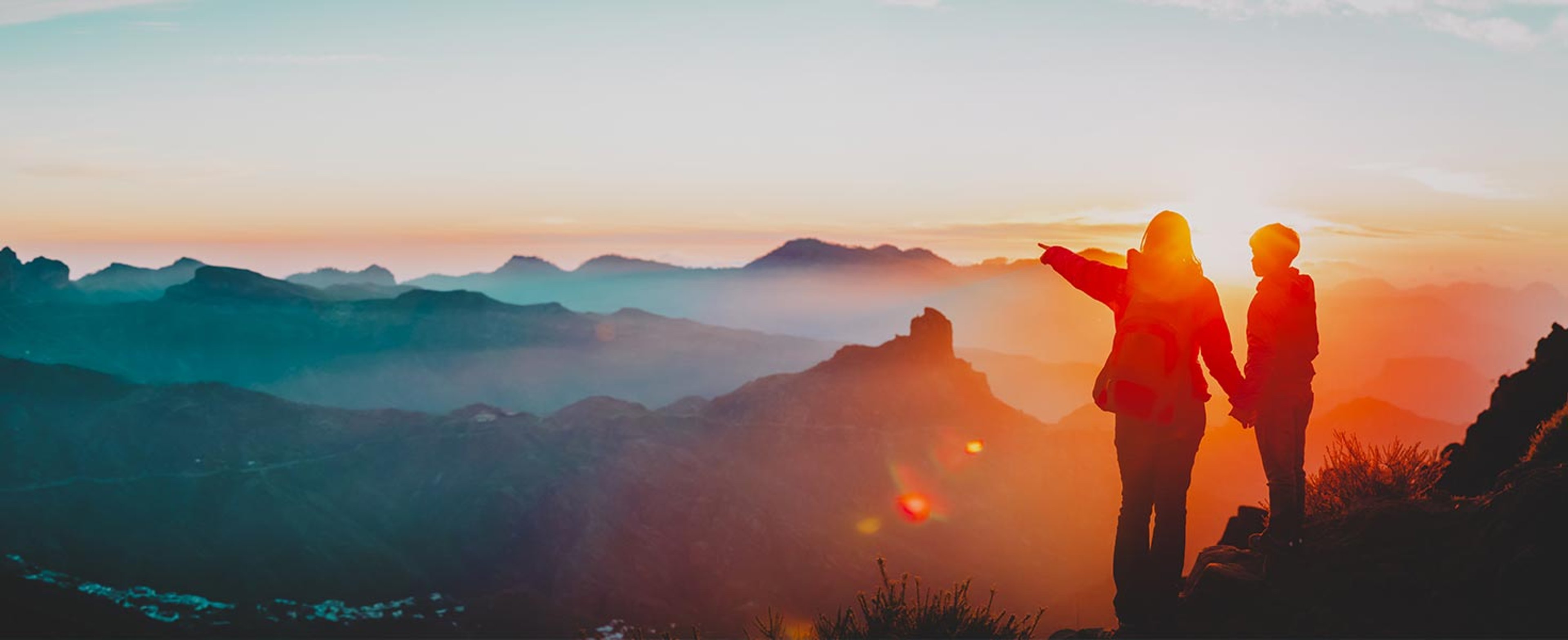 Couple on a sunset mountain hike