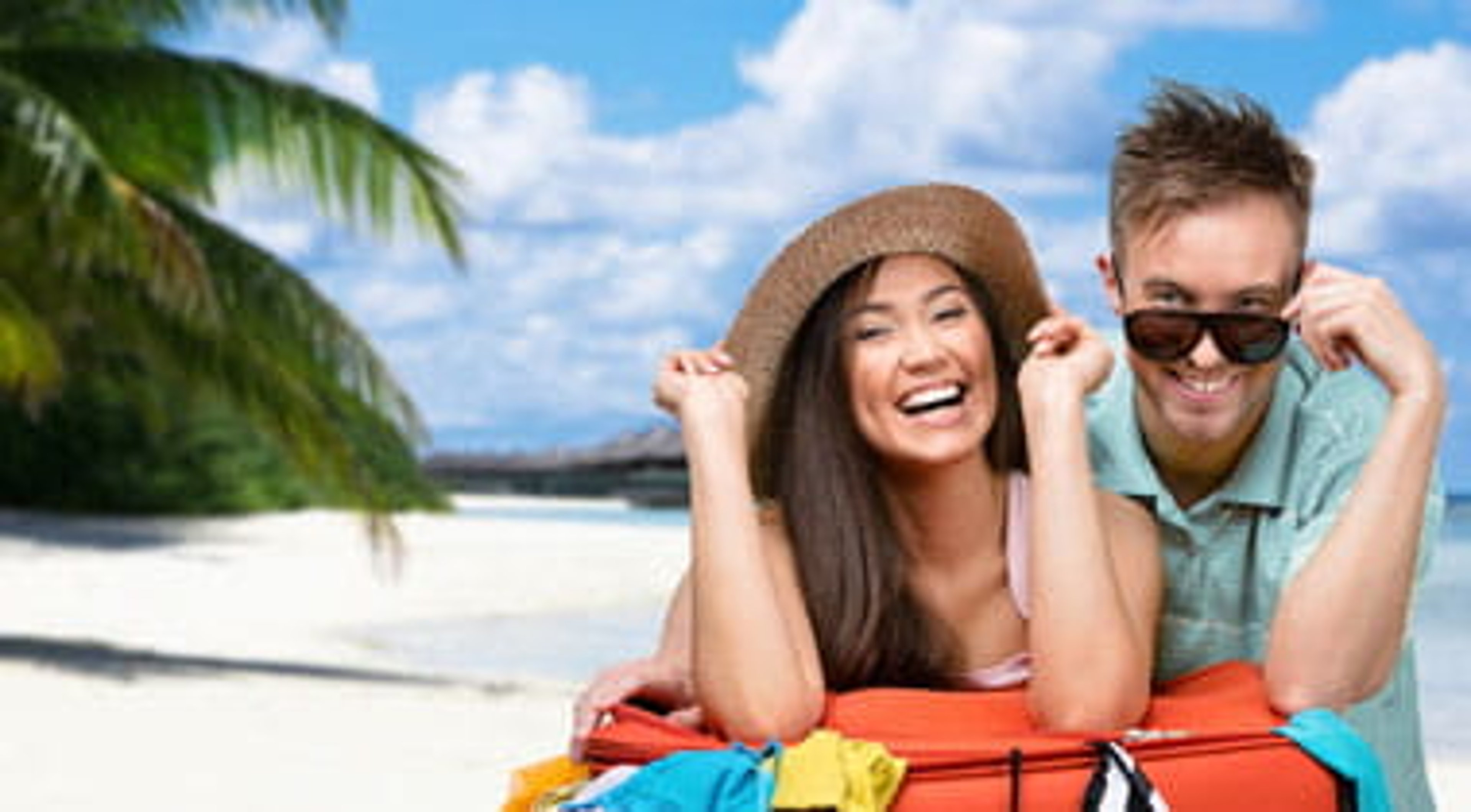 Couple sitting on a beach in the Dominican Republic