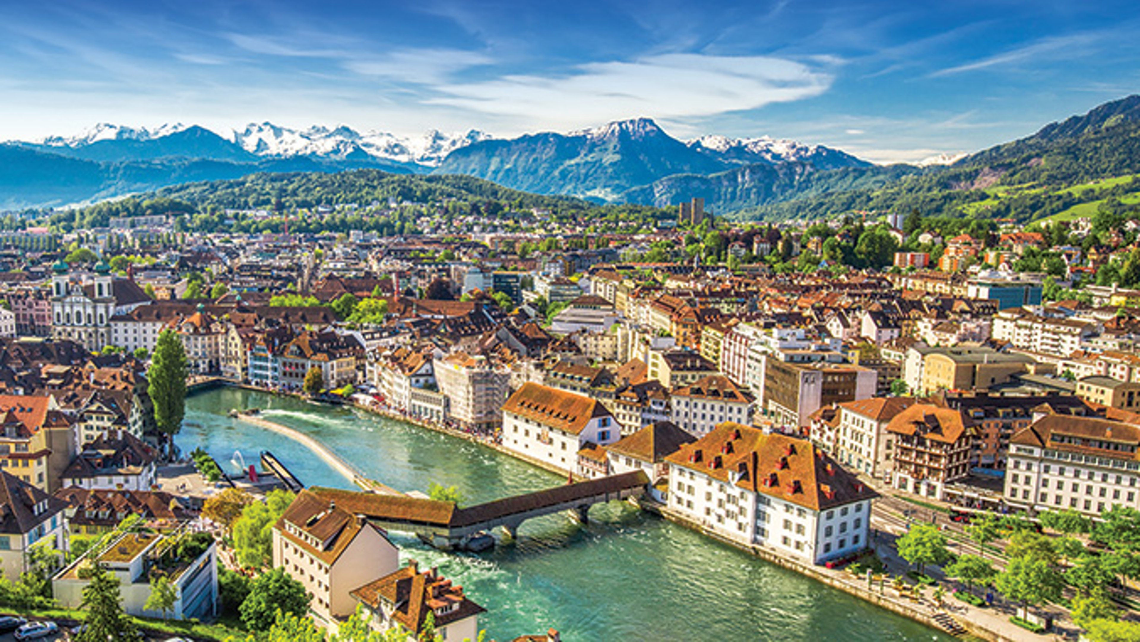 Lucerne from the fortress bastion with old wooden bridge on the Reuss river.
