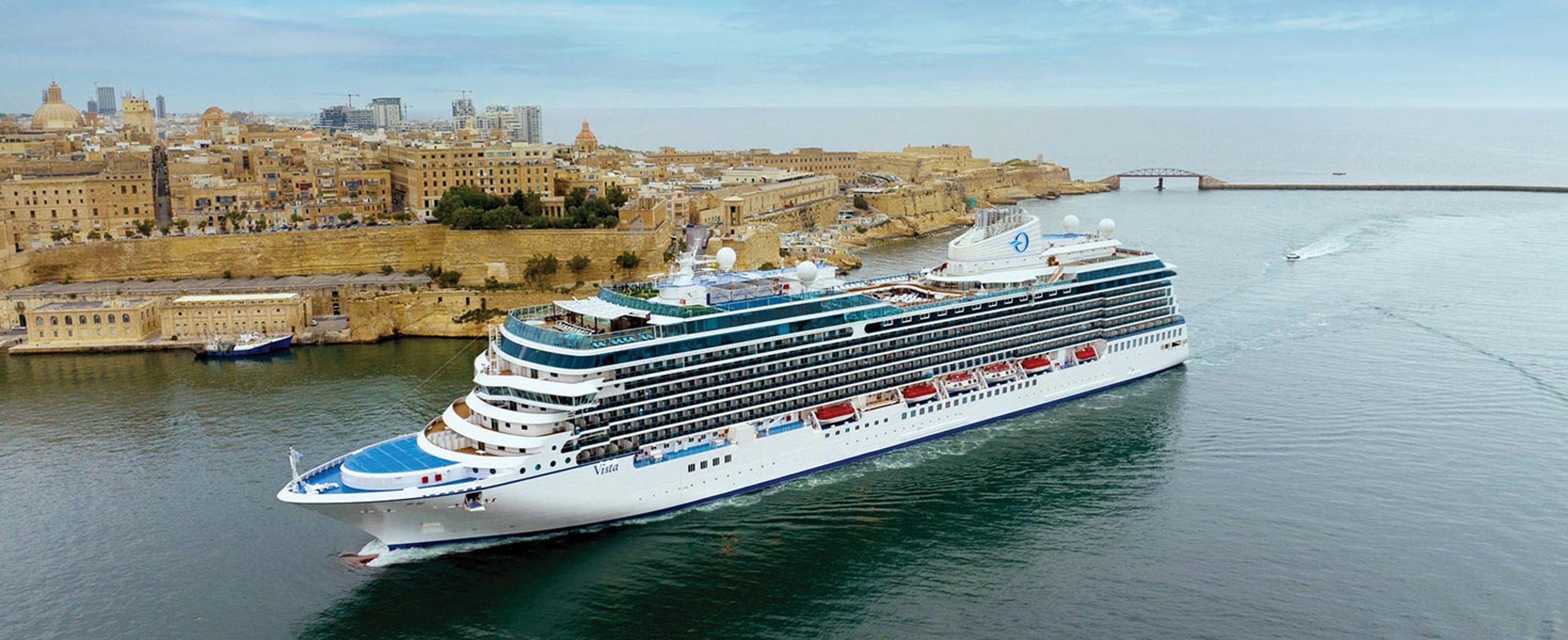 Oceania Vista cruising near Malta coastline