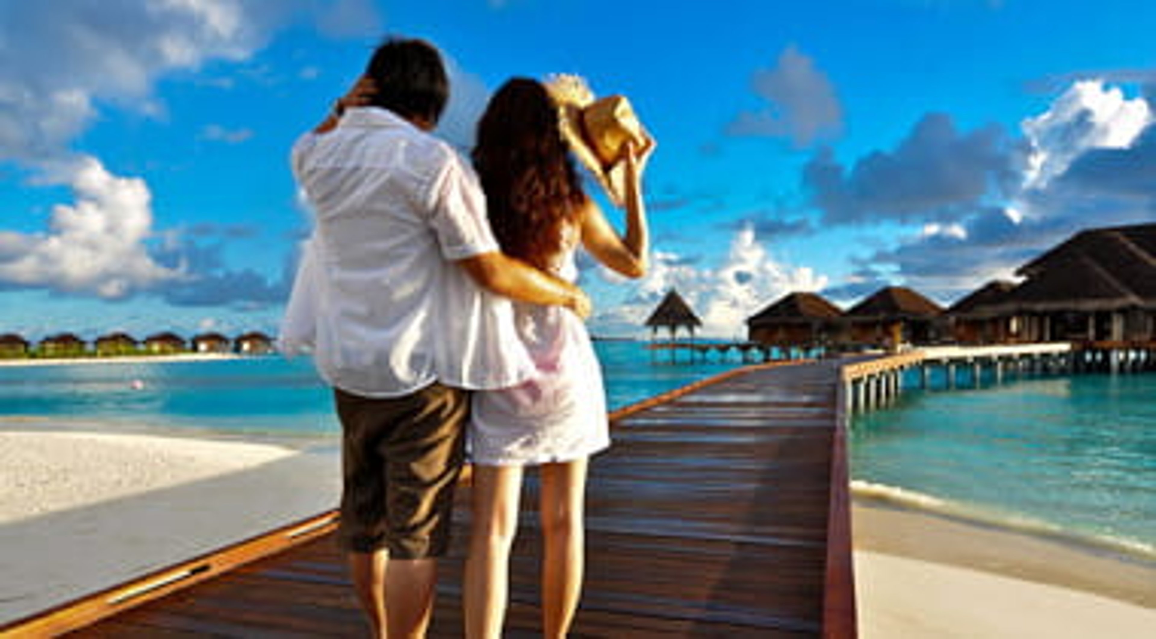 Couple on a pathway of luxury resort