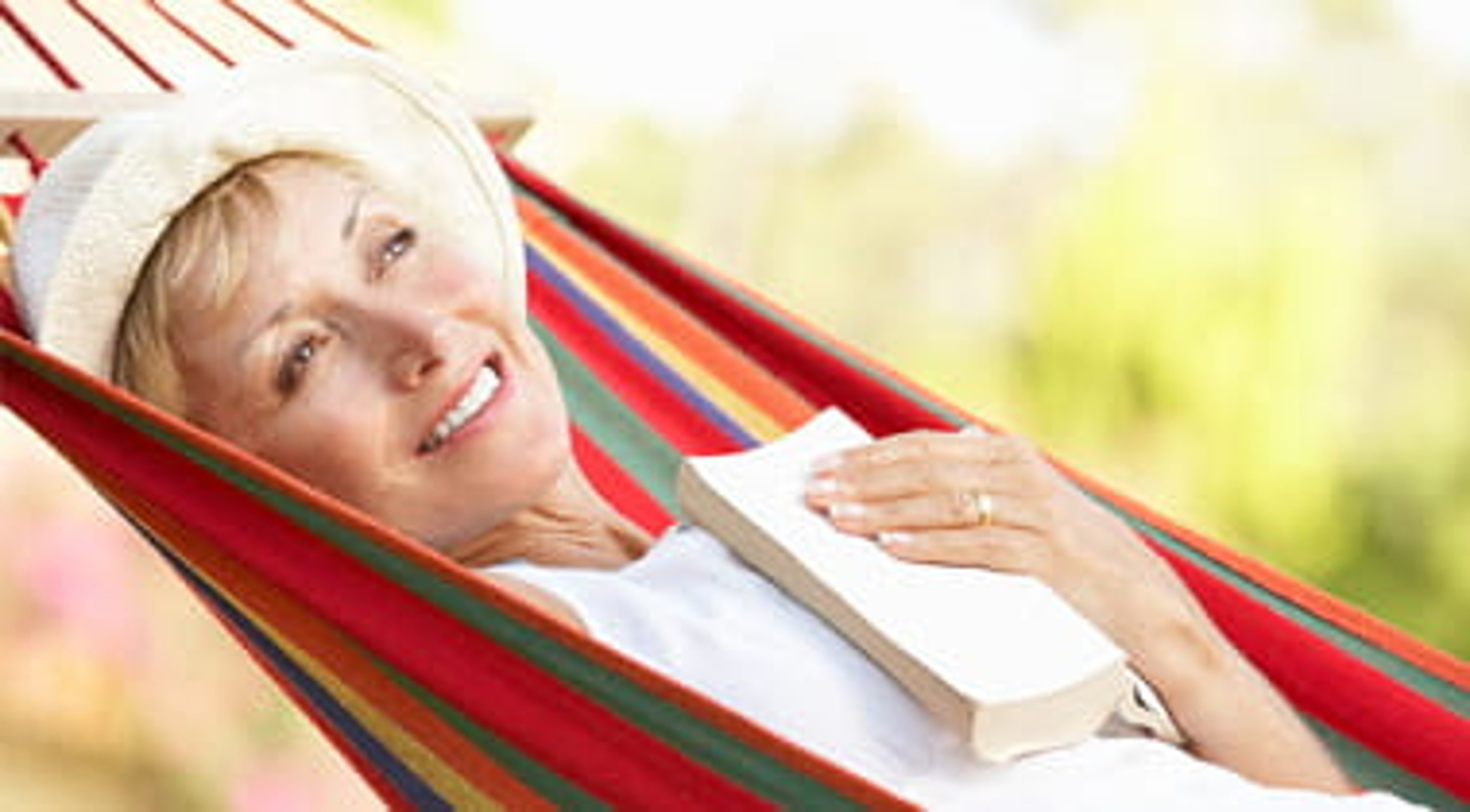 Senior Woman Relaxing In Hammock