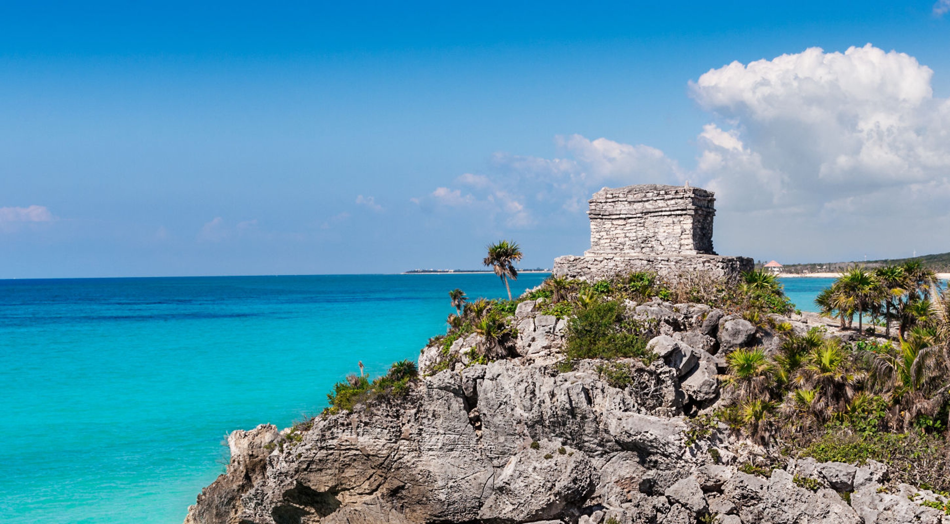 Mayan Temple of the Wind God, perched on a rocky cliff, Tulum, Mexico on the Mexican Riviera