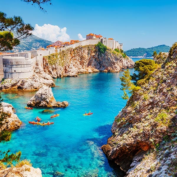 scenic Adriatic coast in Dubrovnik, Croatia, known for its crystal-clear waters and historic city walls.