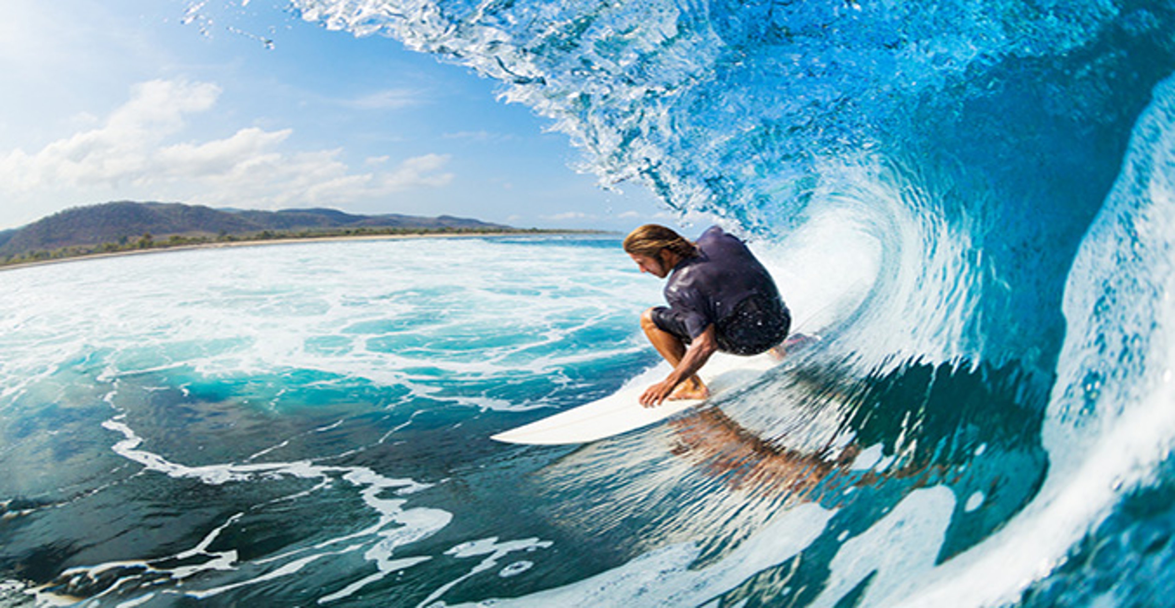 Young man surfing in Hawaii