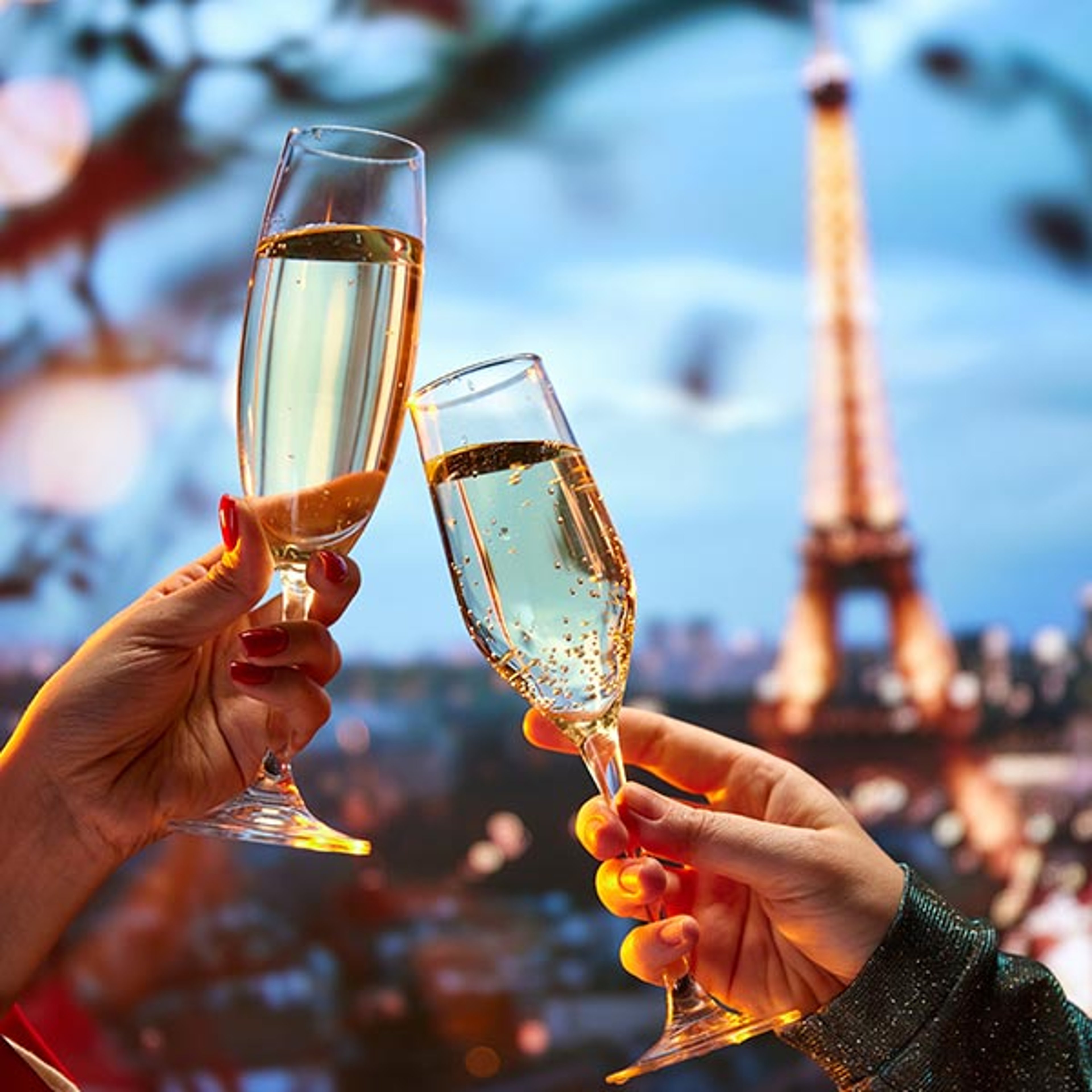 Couple toasting with champagne in front of Eiffel Tower