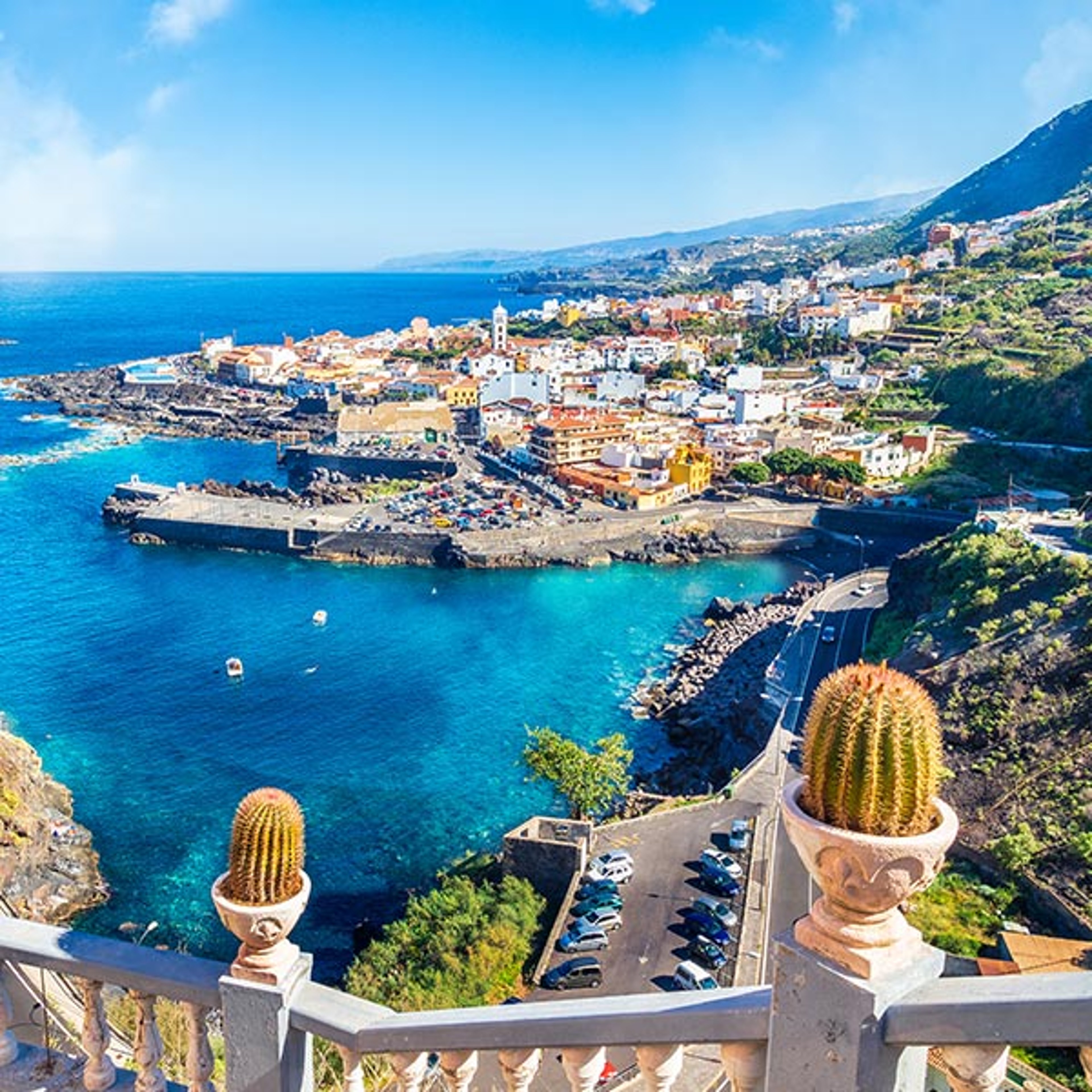 The image shows an elevated coastal view of Garachico, a historic town on the northern coast of Tenerife in the Canary Islands, Spain