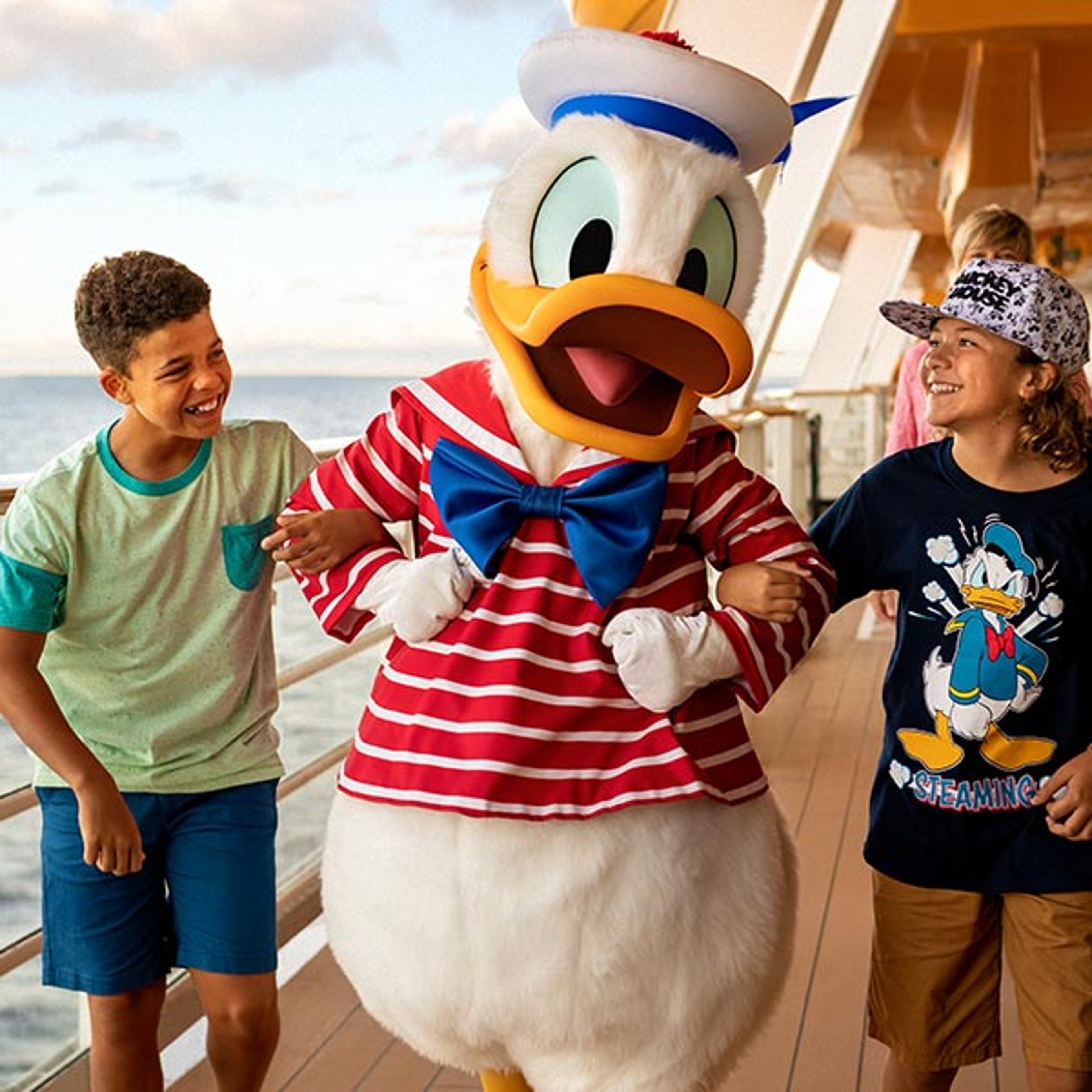 Boys with Donald Duck on Disney cruise