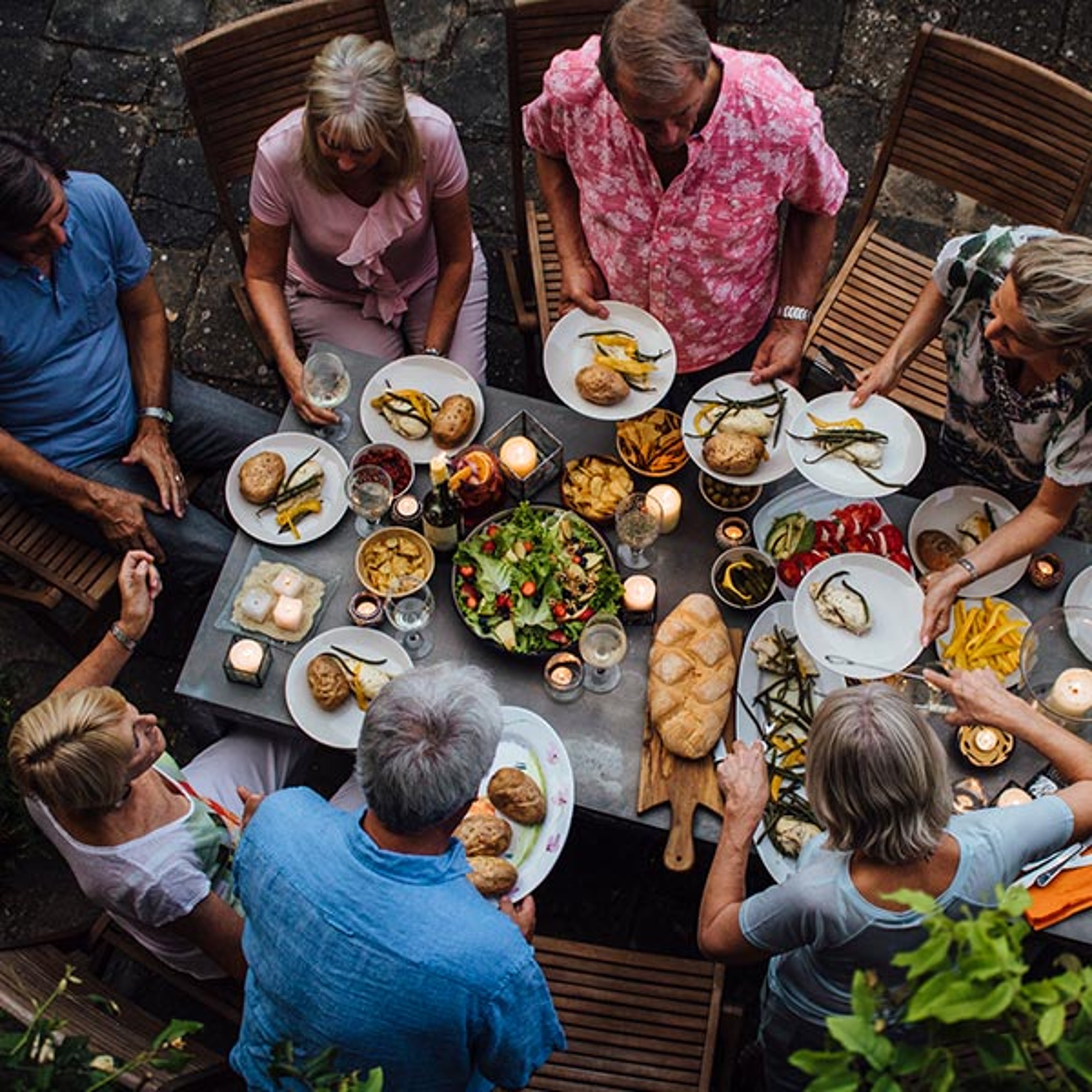 Friends on a guided vacation enjoying a nice dinner in Tuscany