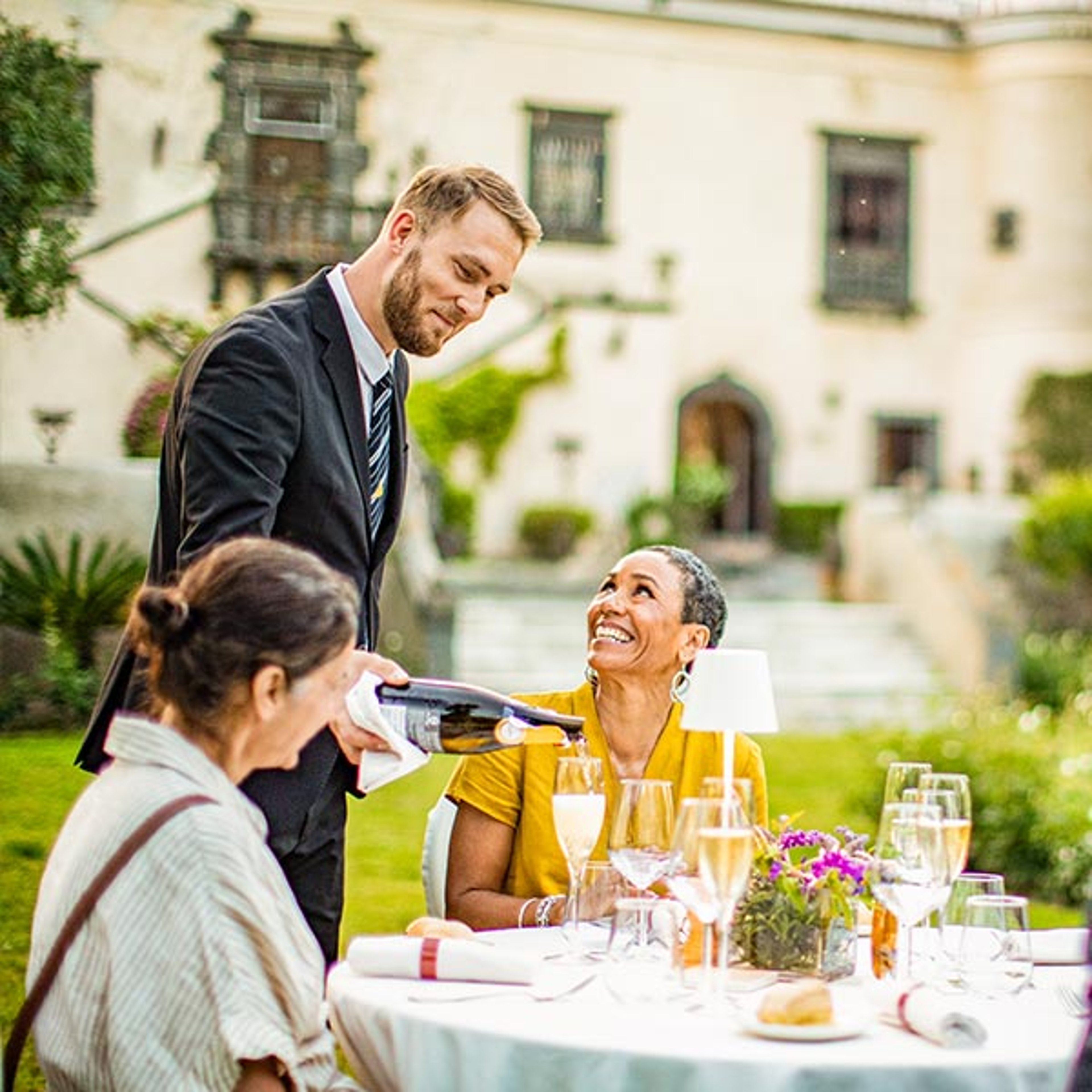 Couple enjoying an outdoor dining experience while touring Castello San Marco