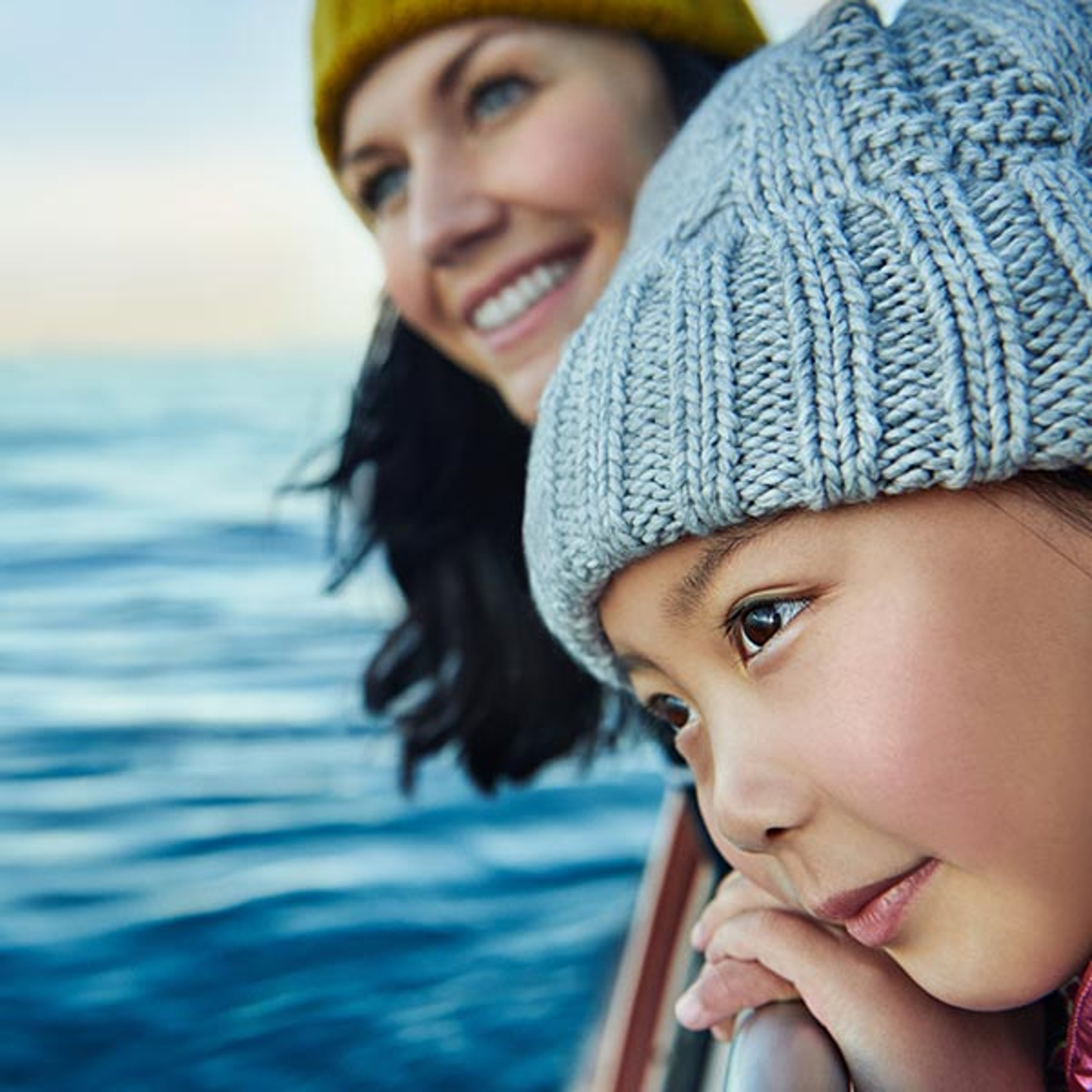 Mom and daughter watching whales aboard Princess cruise ship