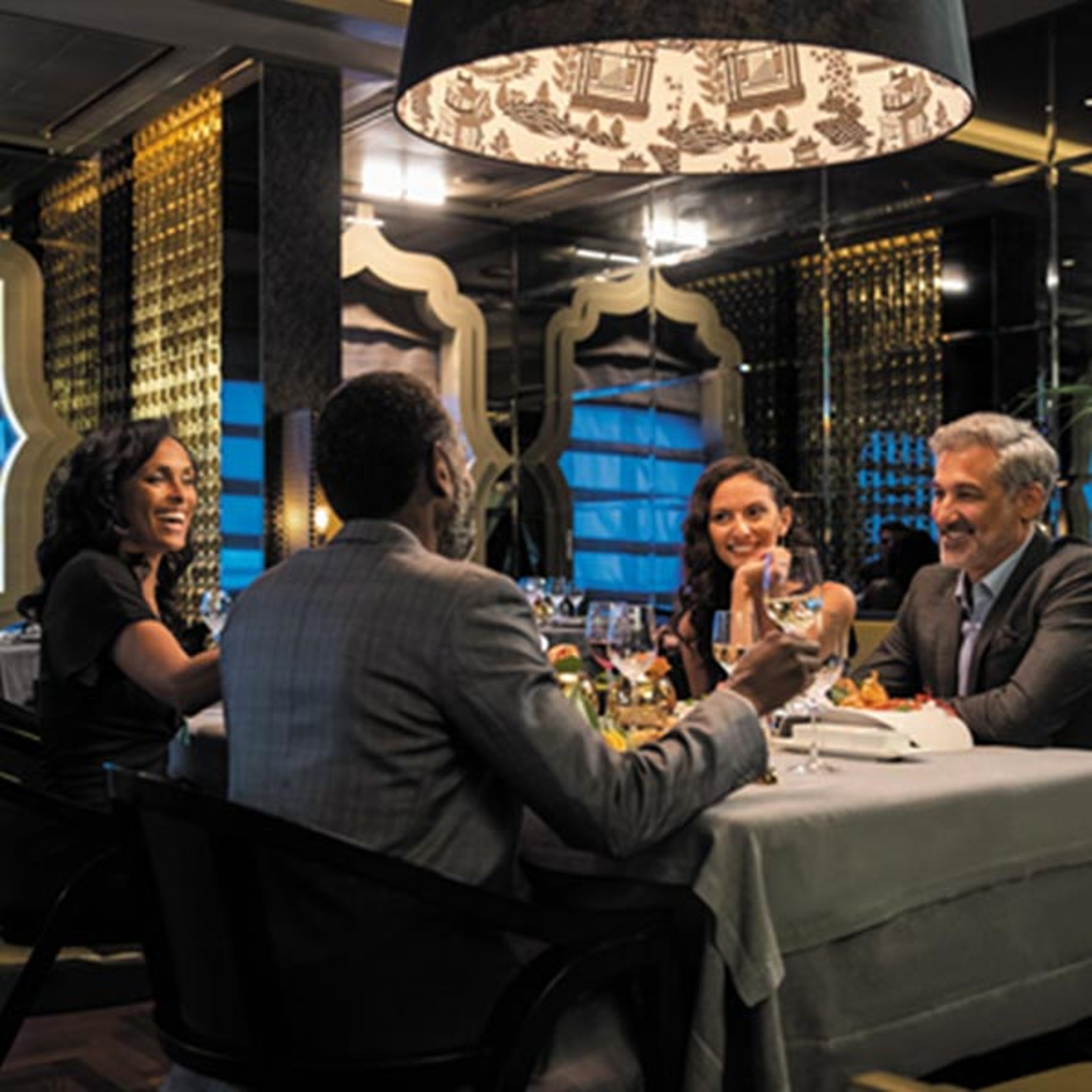 couples at dinner aboard Regent ship