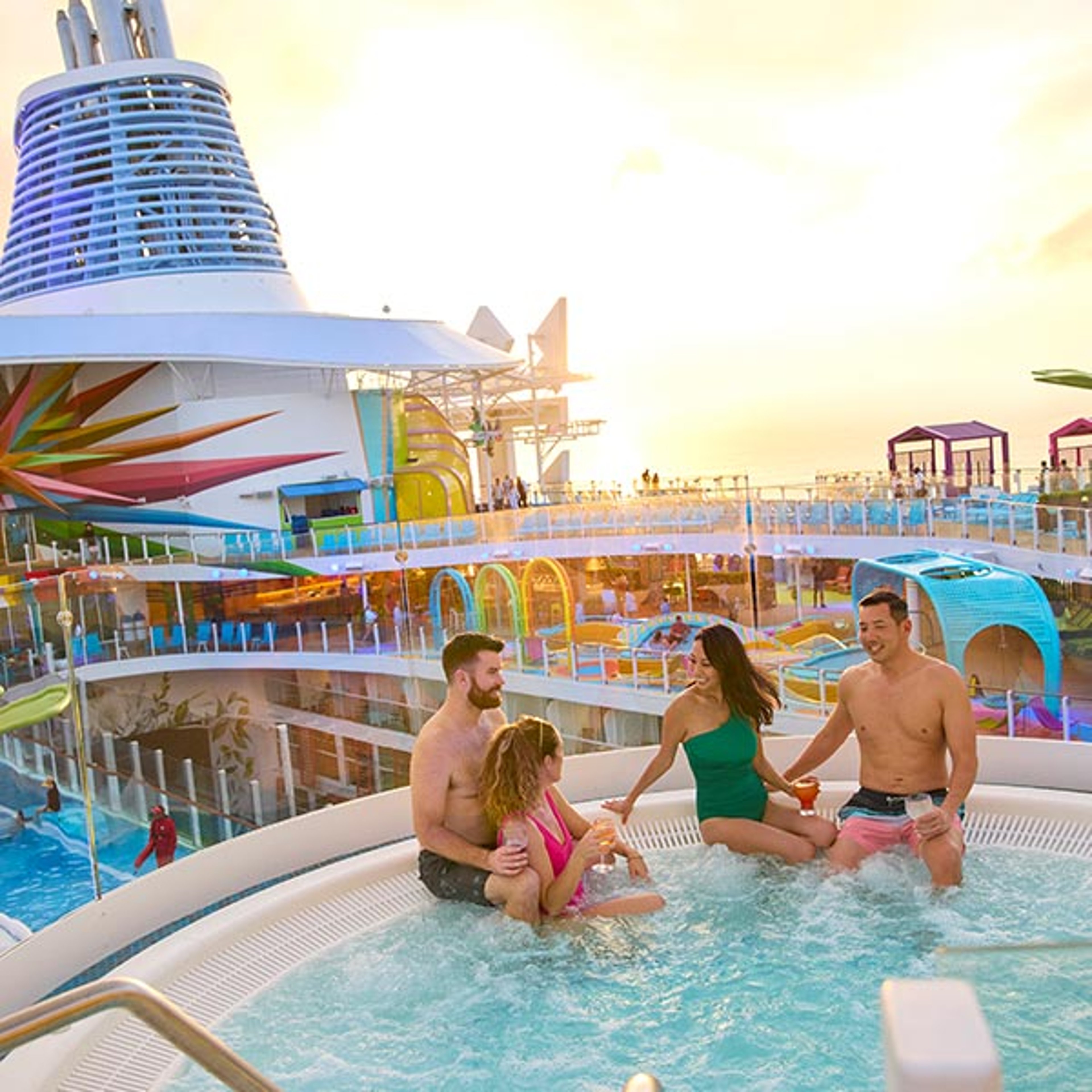 Two couples visiting while enjoying the hot tub aboard their Royal Caribbean cruise ship