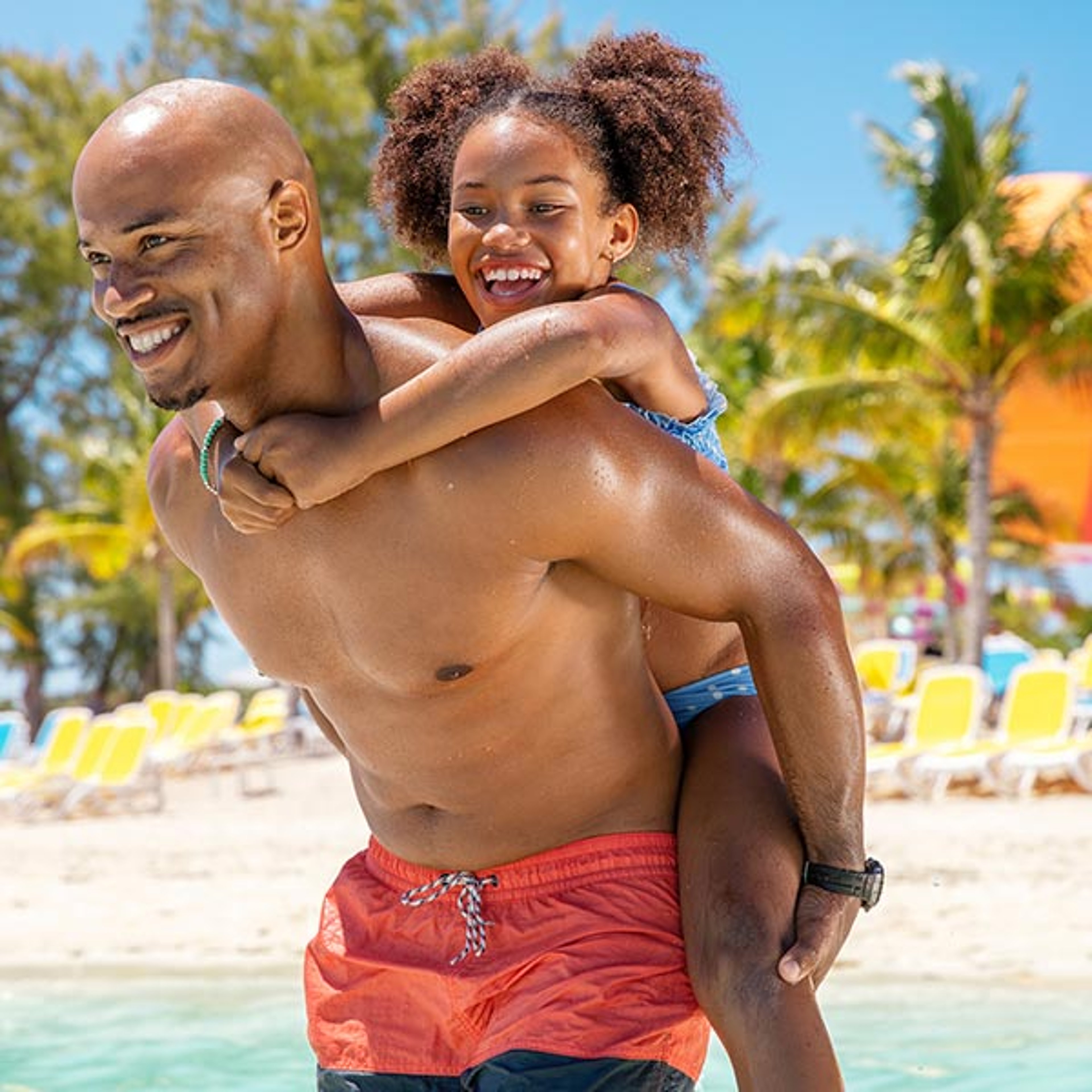 Dad and Daughter playing in water at Royal Caribbean private island