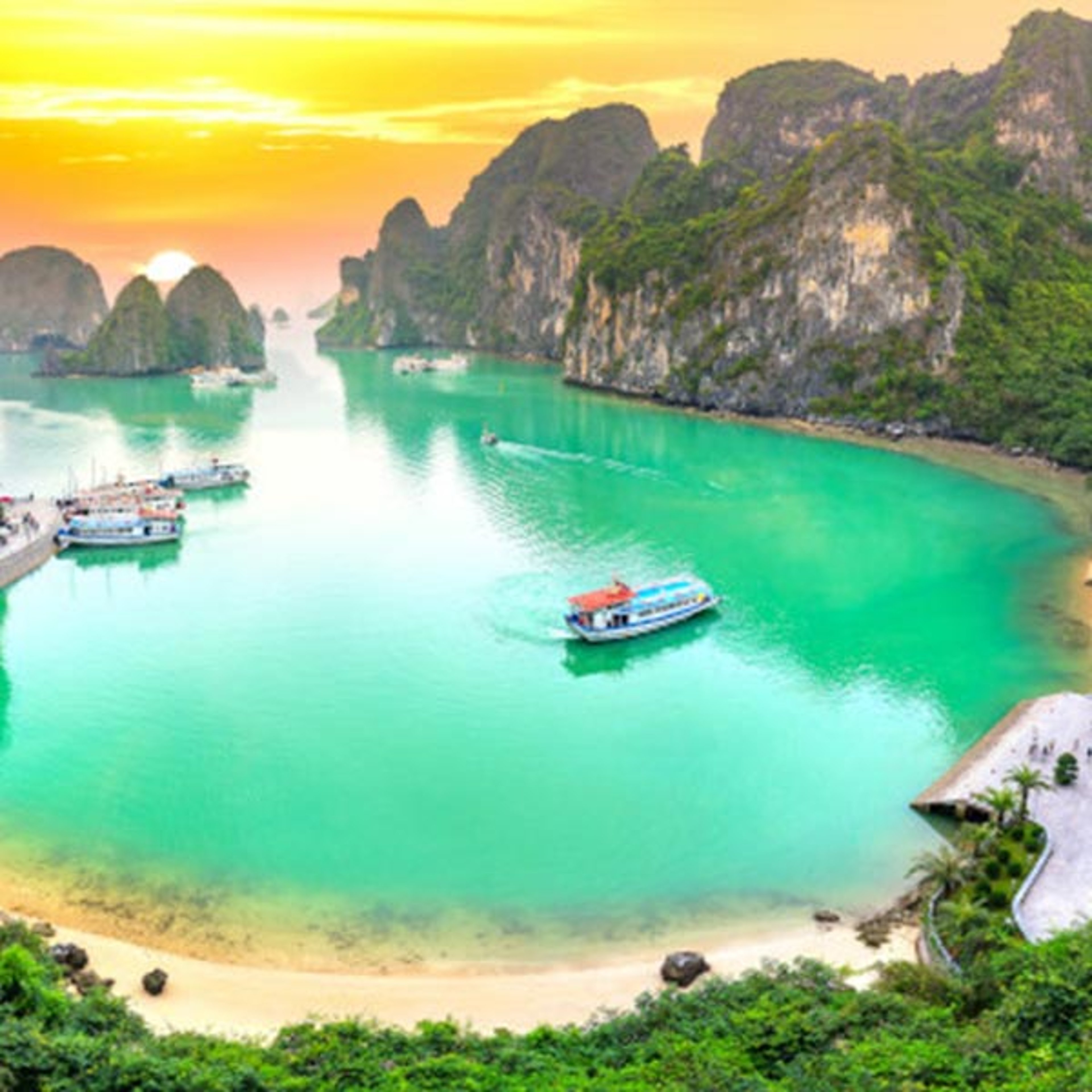 Small boats docked in a small Asian cove