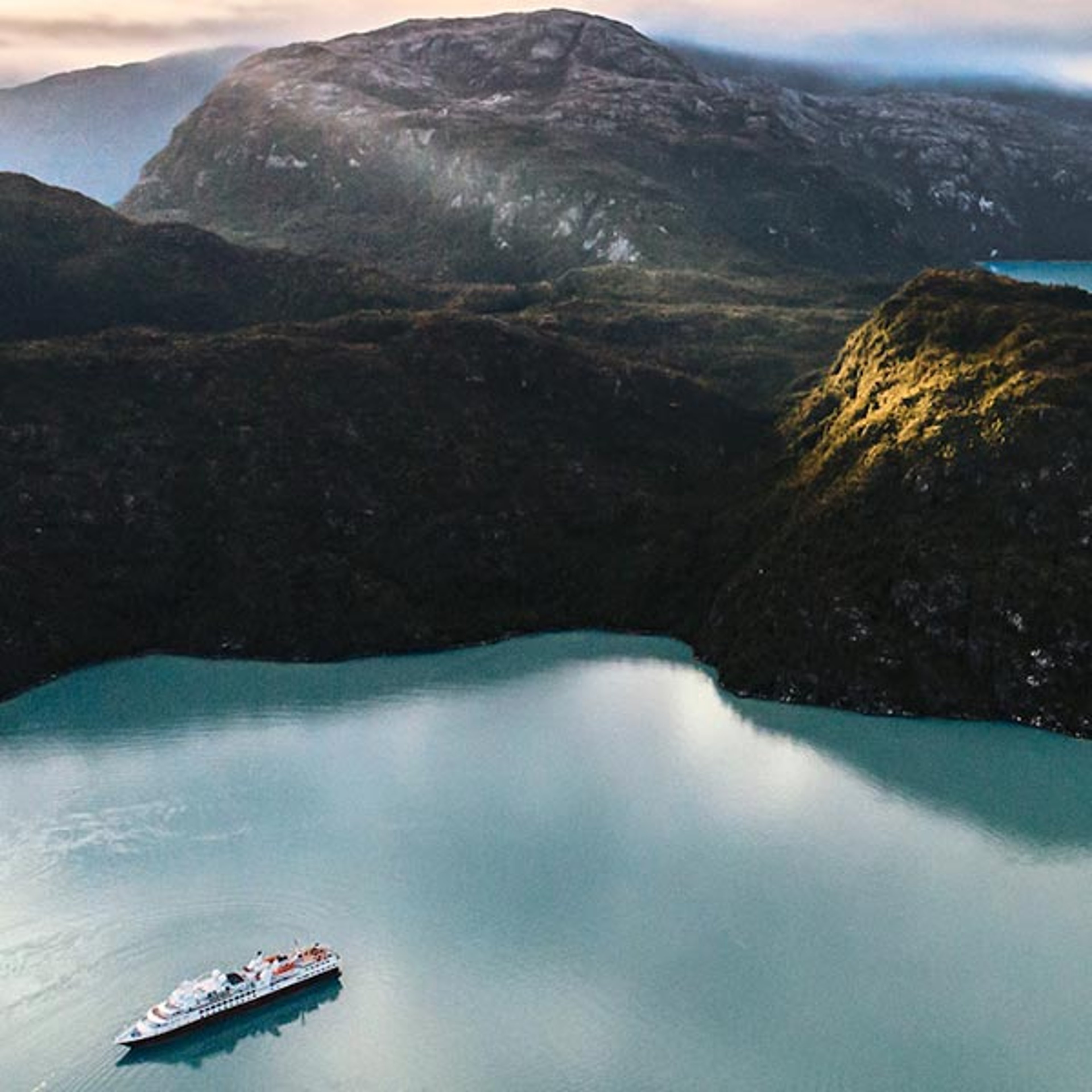 Silversea ship sailing into a bay