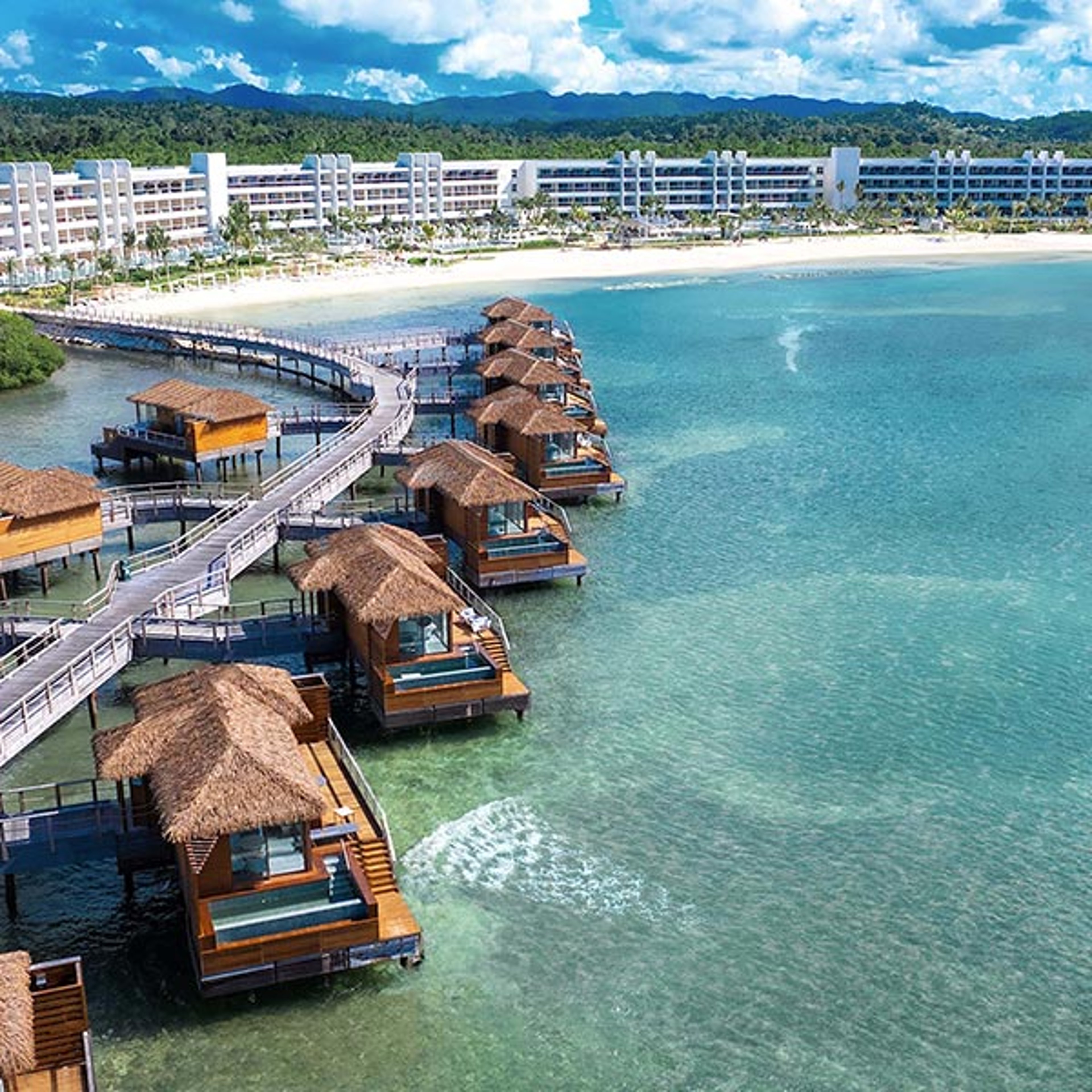 Overwater cabanas at a resort in the Caribbean