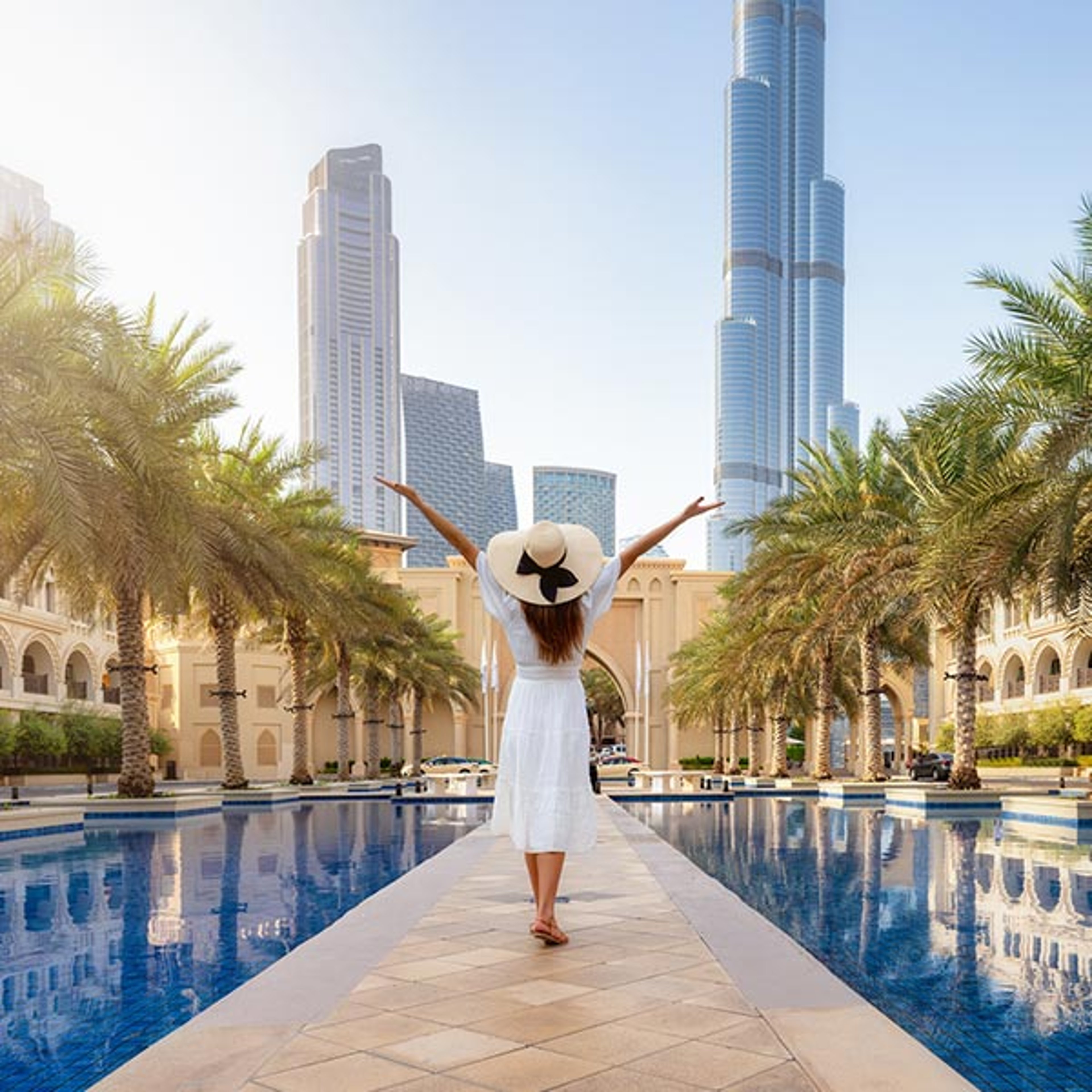Woman in white dress walking in Dubai