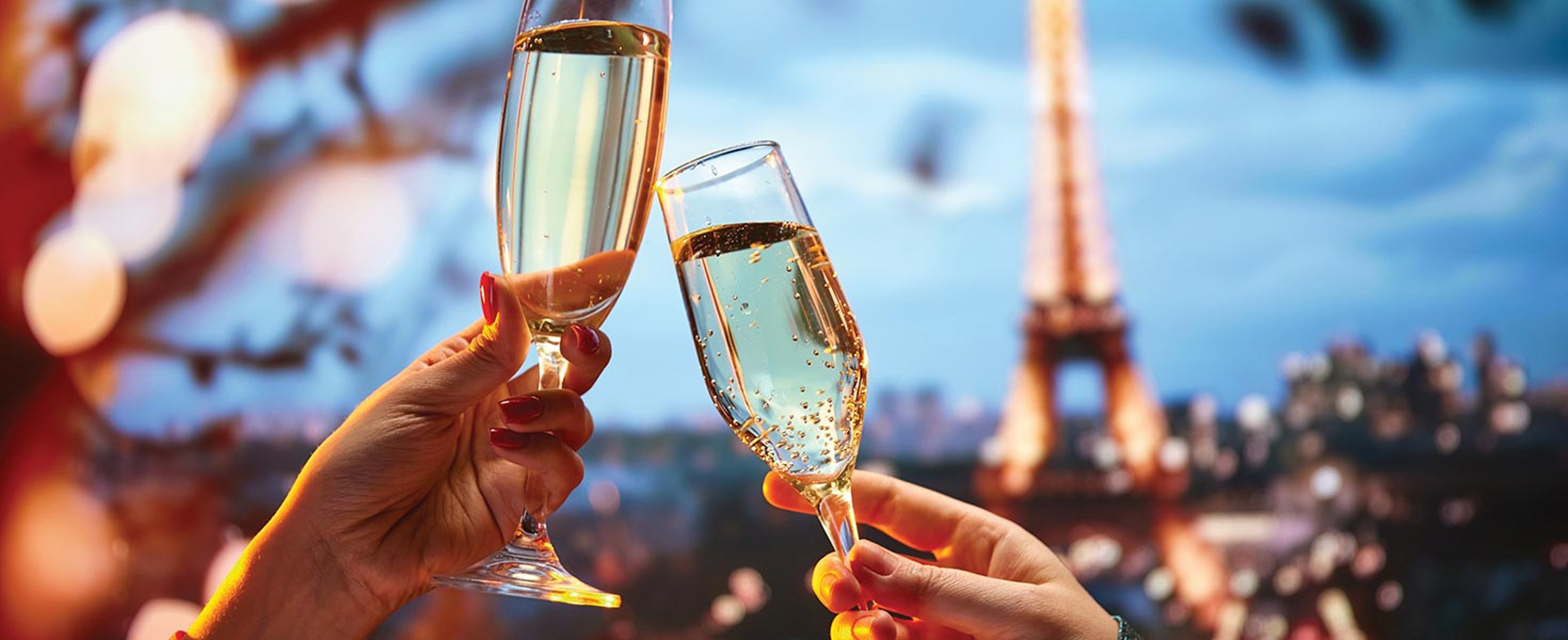 Couple toasting with Eiffel Tower in background