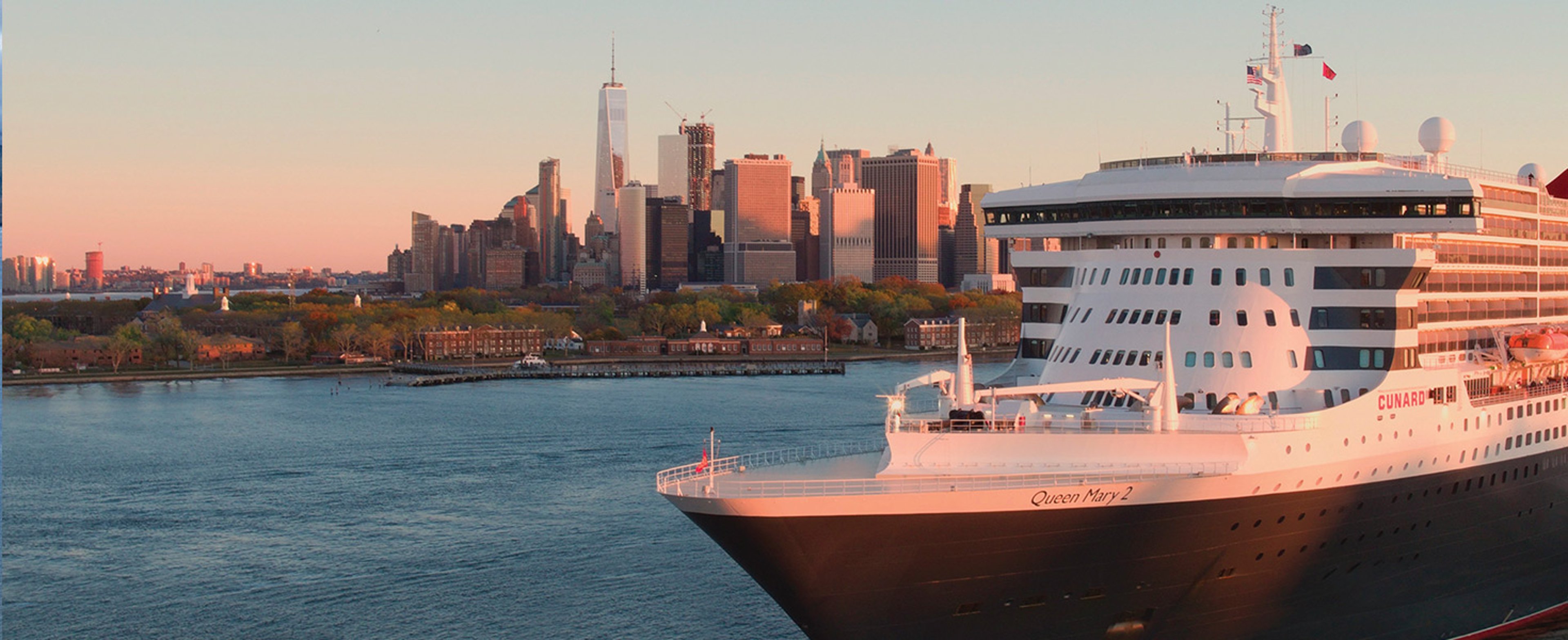 Cunard's Queen Mary 2 sailing in New York Harbor, with the Lower Manhattan skyline