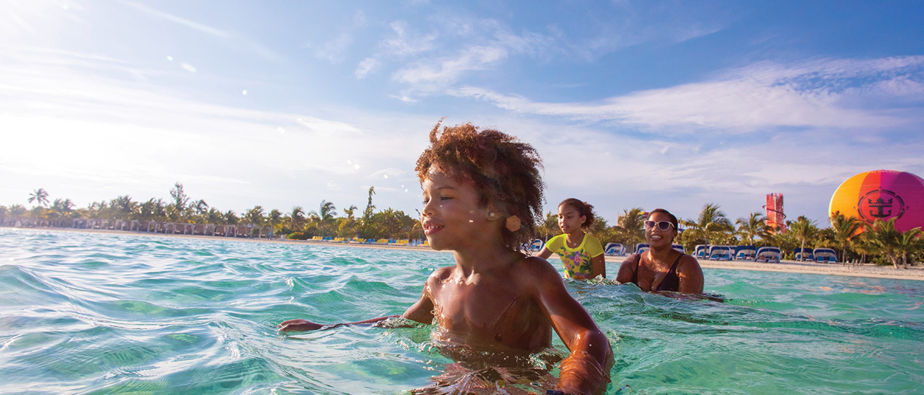 Family playing in the ocean off the coast of Royal Caribbean's CocoCay.