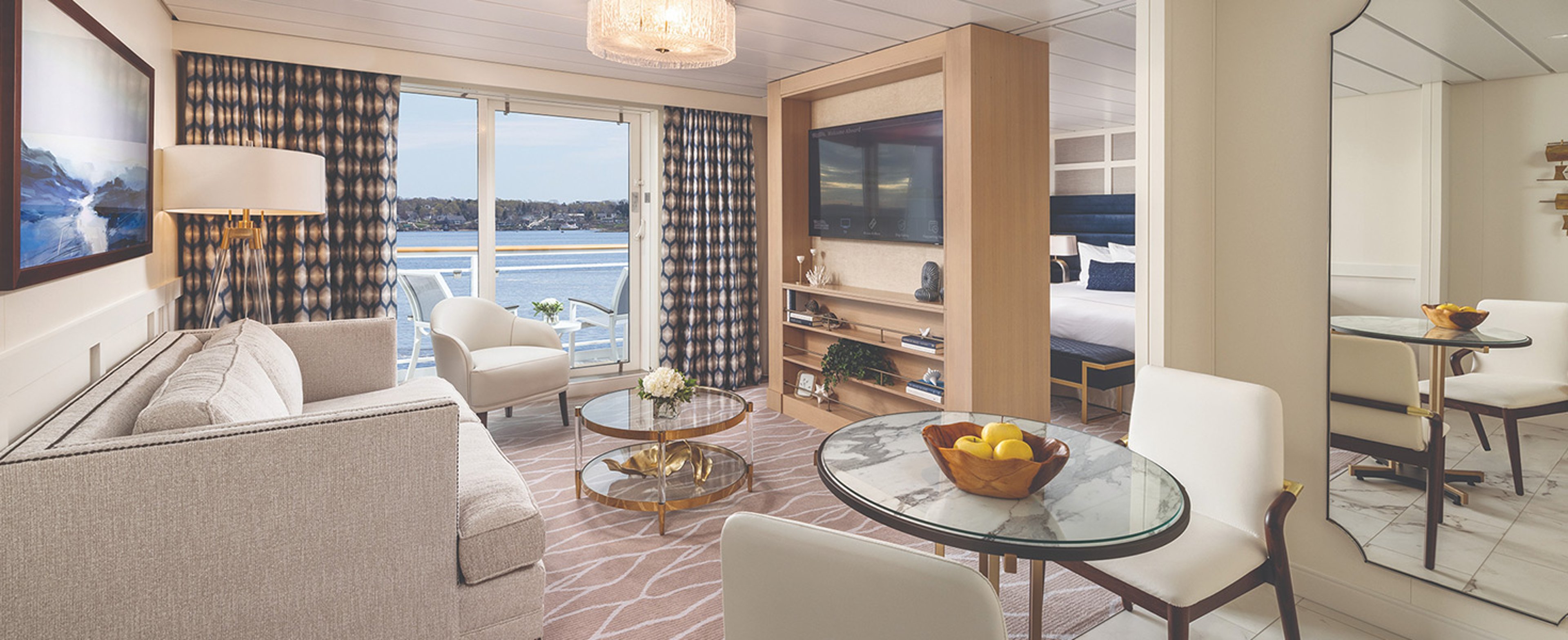 Seating area with view out onto the balcony in the Grand Suite aboard America Cruise Lines Eagle