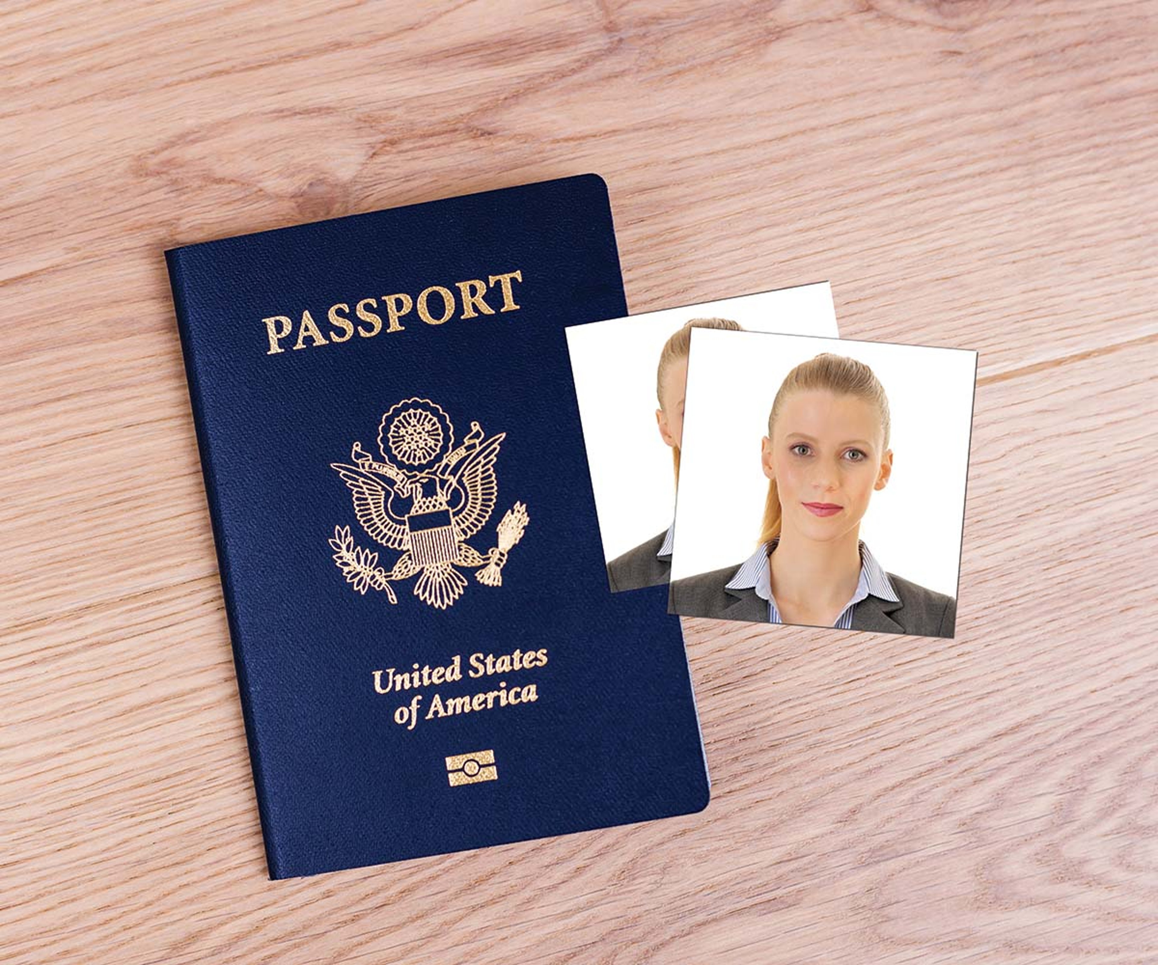 Two identical passport photos of a woman resting on a United States passport.