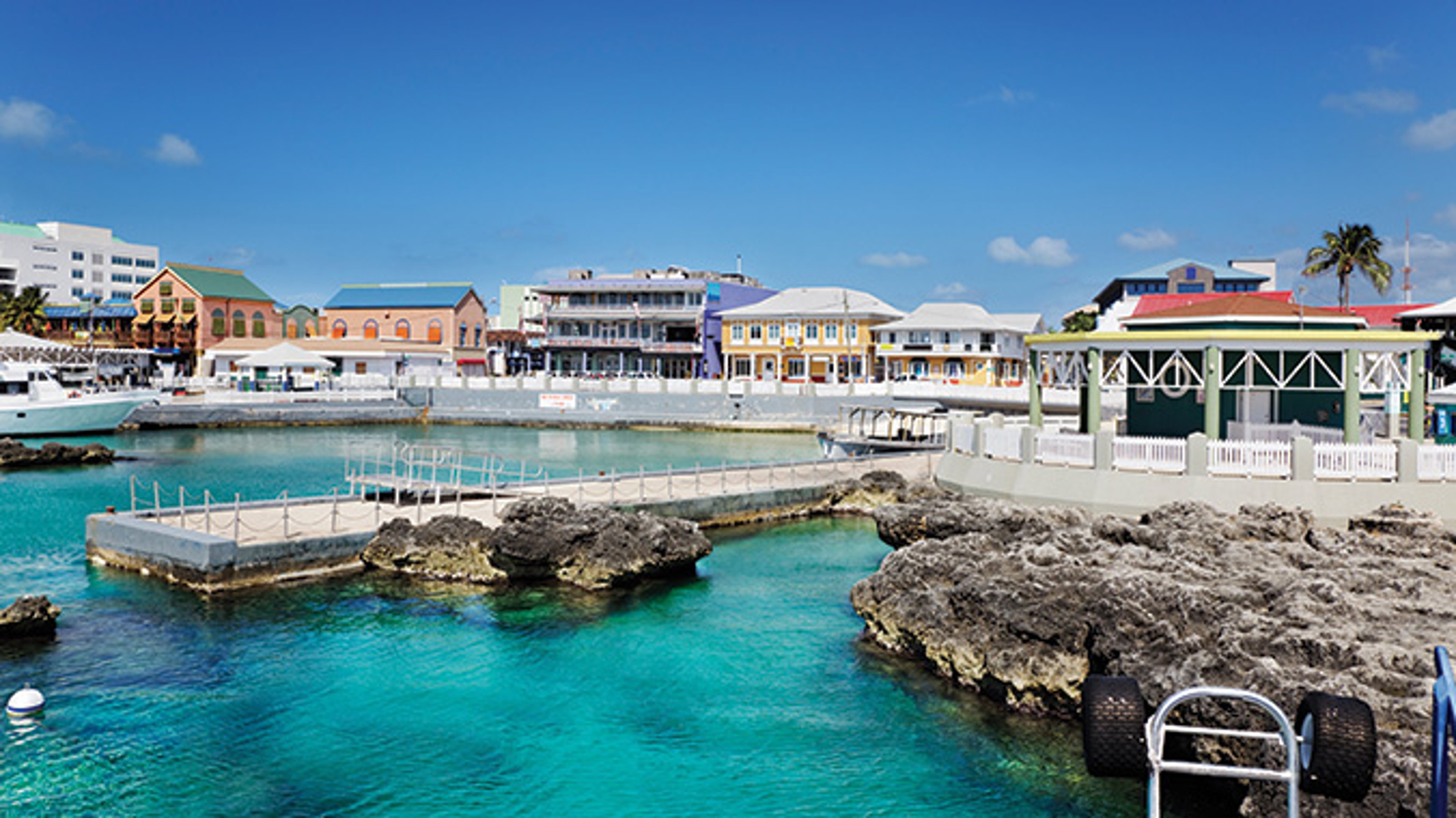 AAA Travel Set Sail Explorations by AAA Blue waters in rocky bay at George Town, Grand Cayman