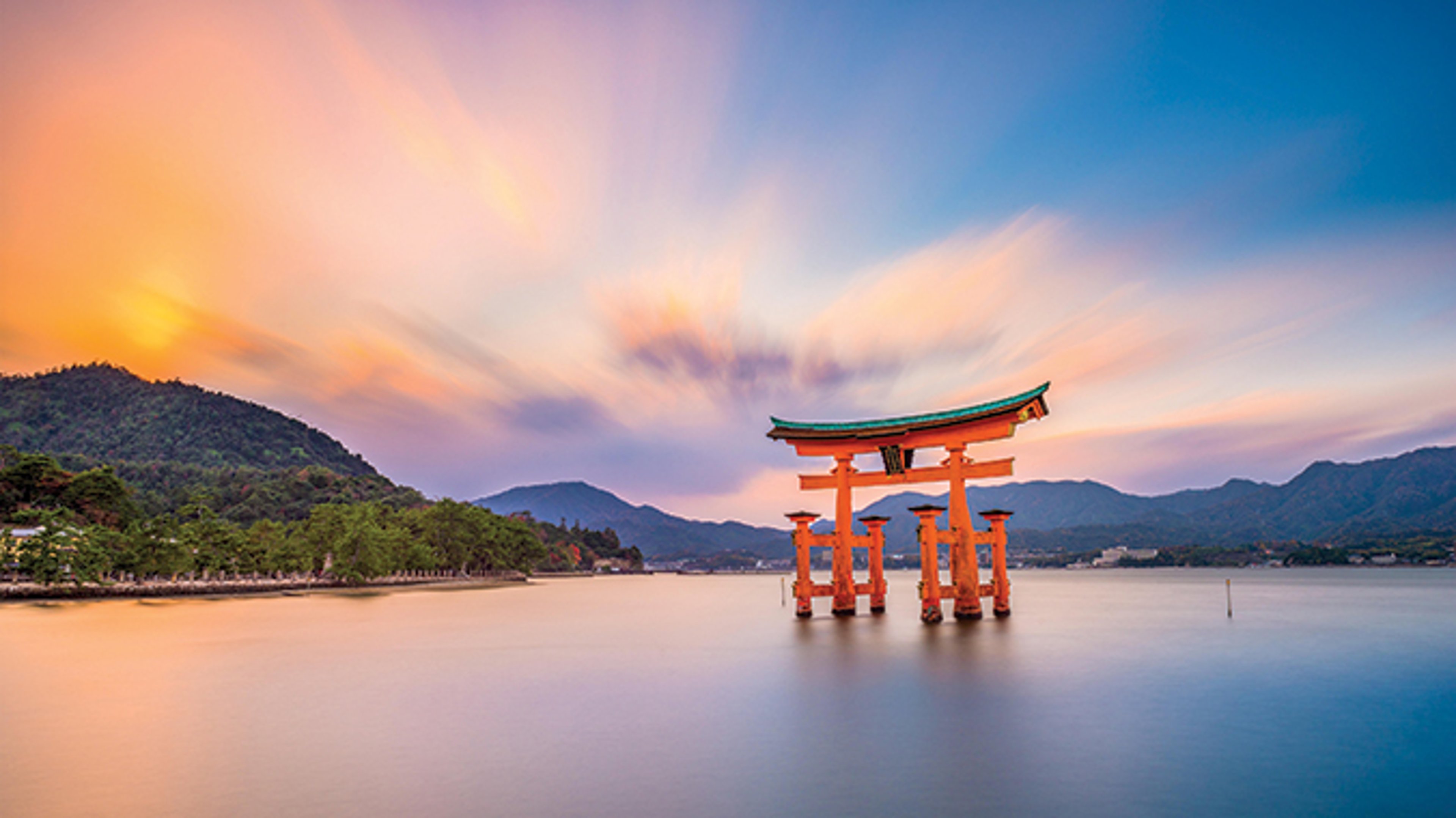 AAA Travel Set Sail Viking Cruises Itsukushima Jinja Shrine floating torii at sunrise in Hatsukaichi, Japan