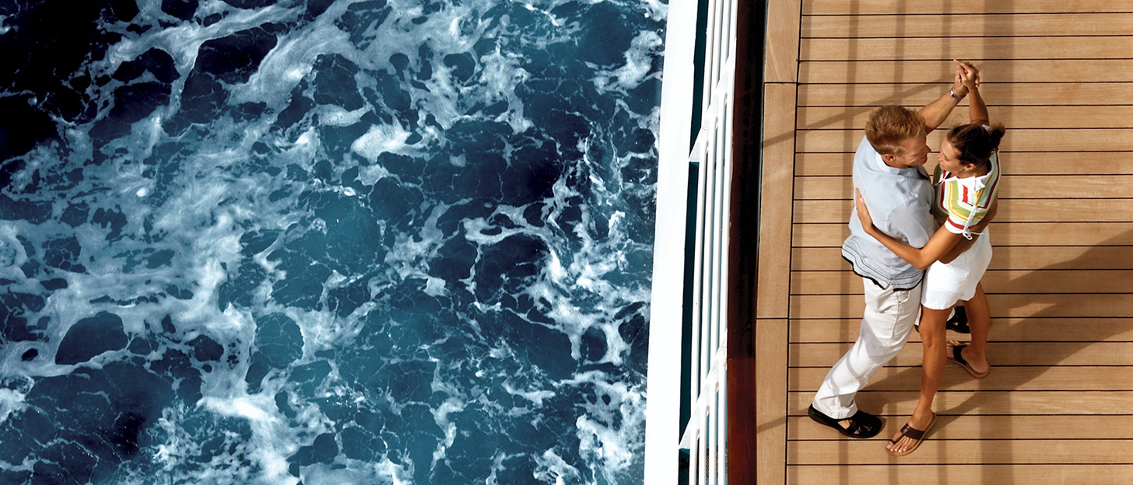 Couple dancing on cruise ship deck