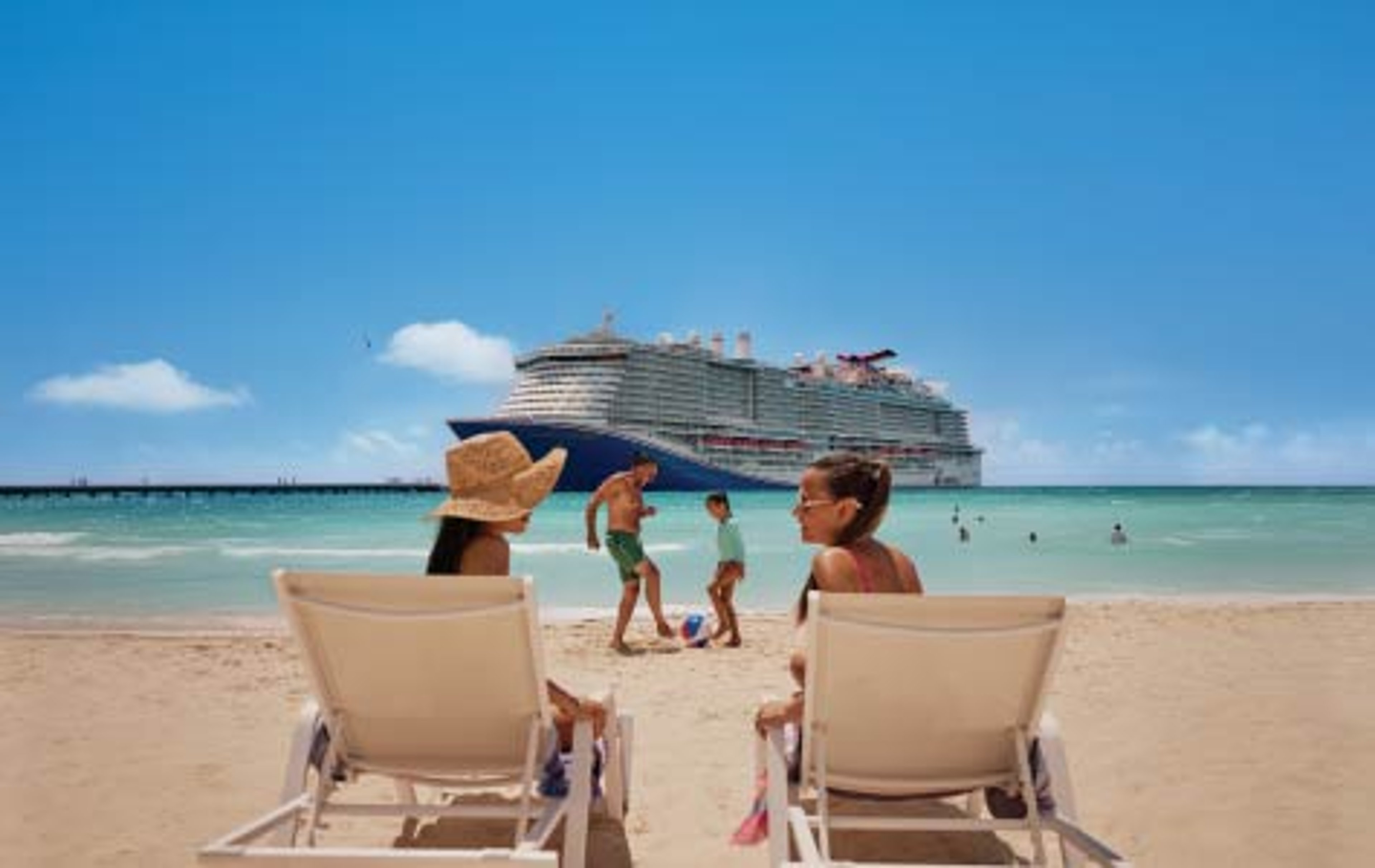 Family on a beach with a Carnival ship in the background