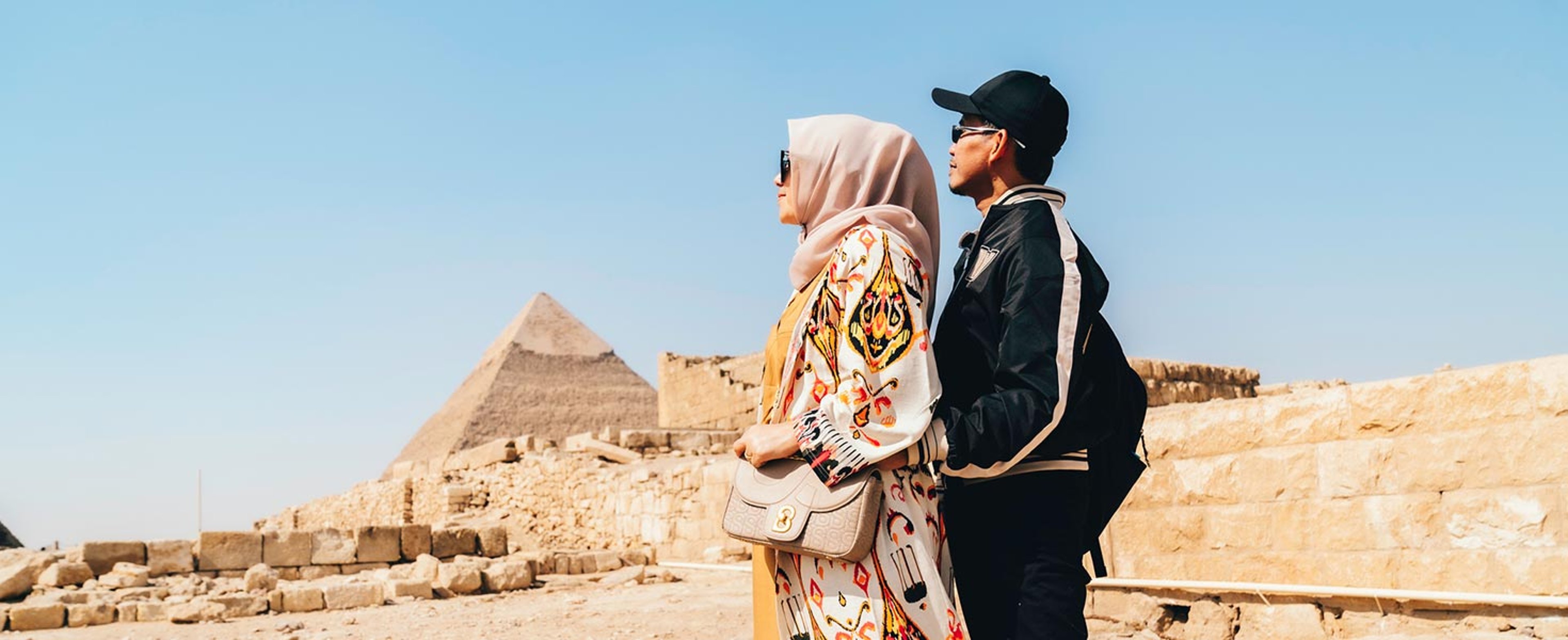 Couple viewing pyramids in Giza
