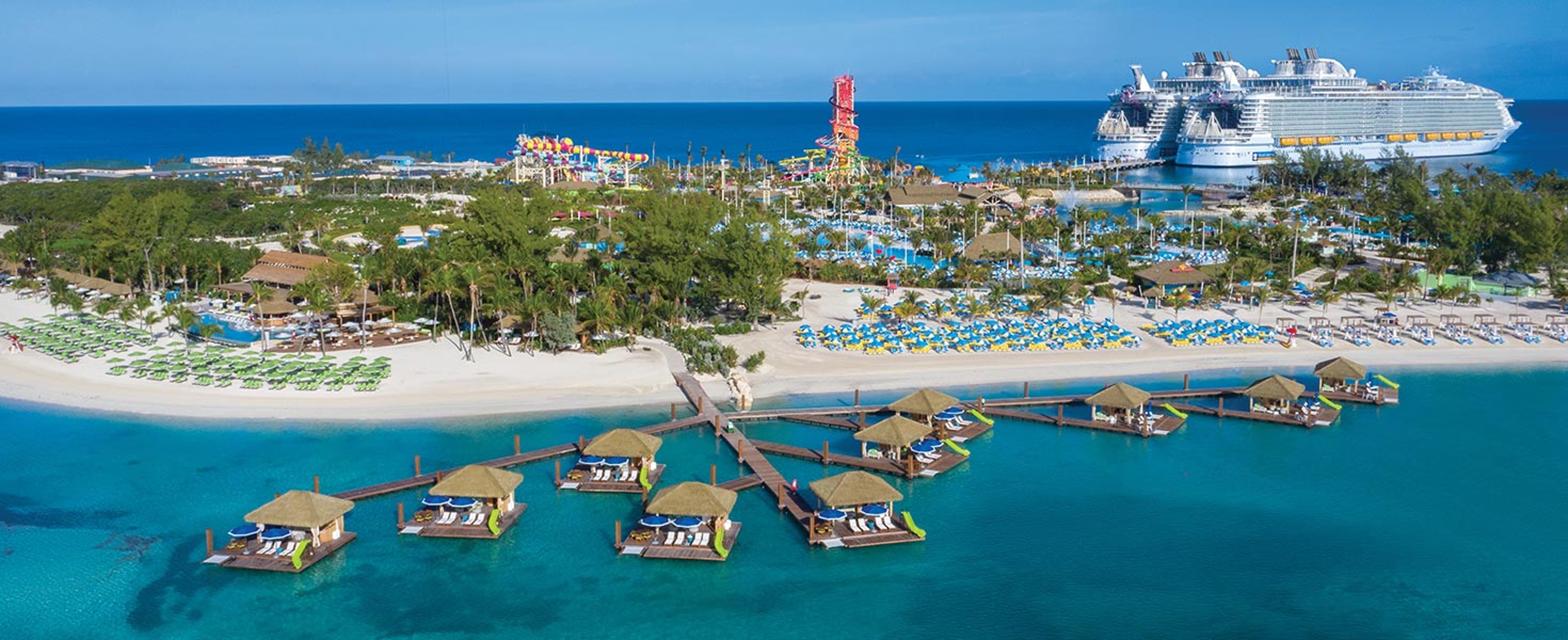 Over water cabanas and beach with beach chairs at Perfect Day