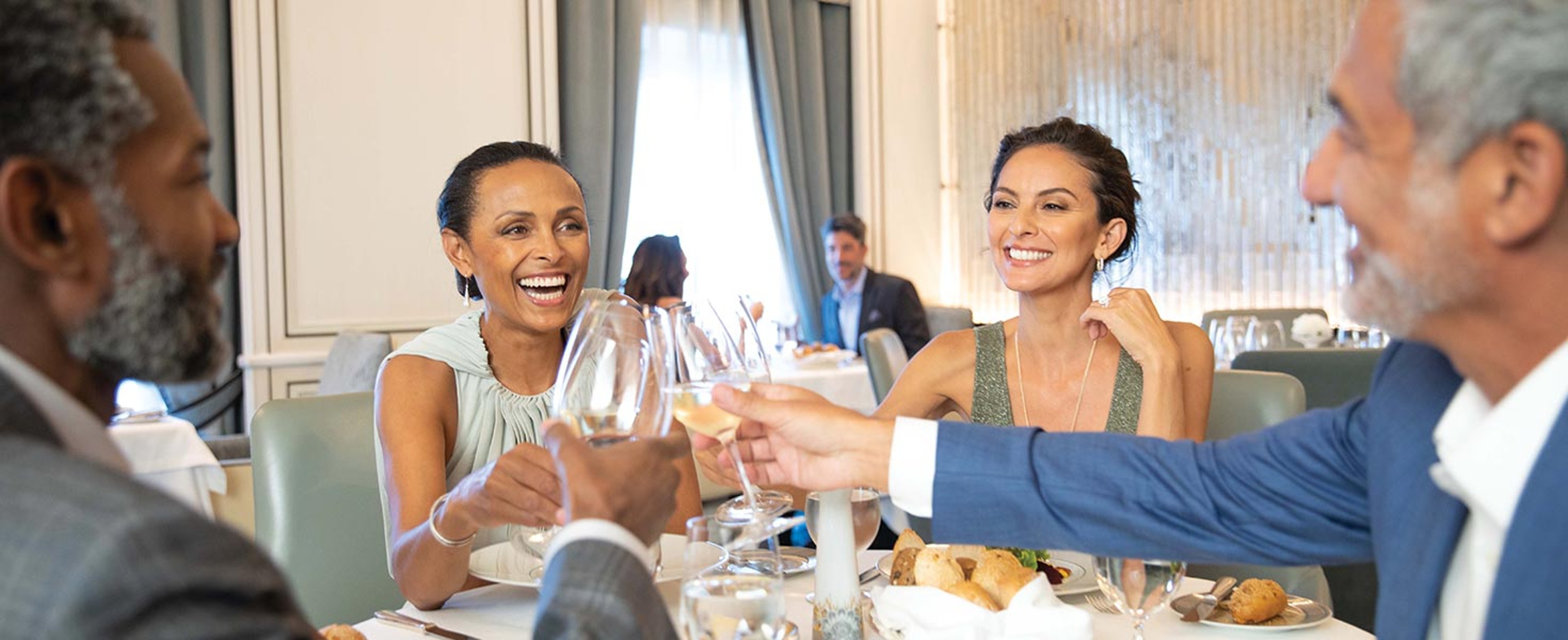Group enjoying dinner aboard Regent Seven Seas ship
