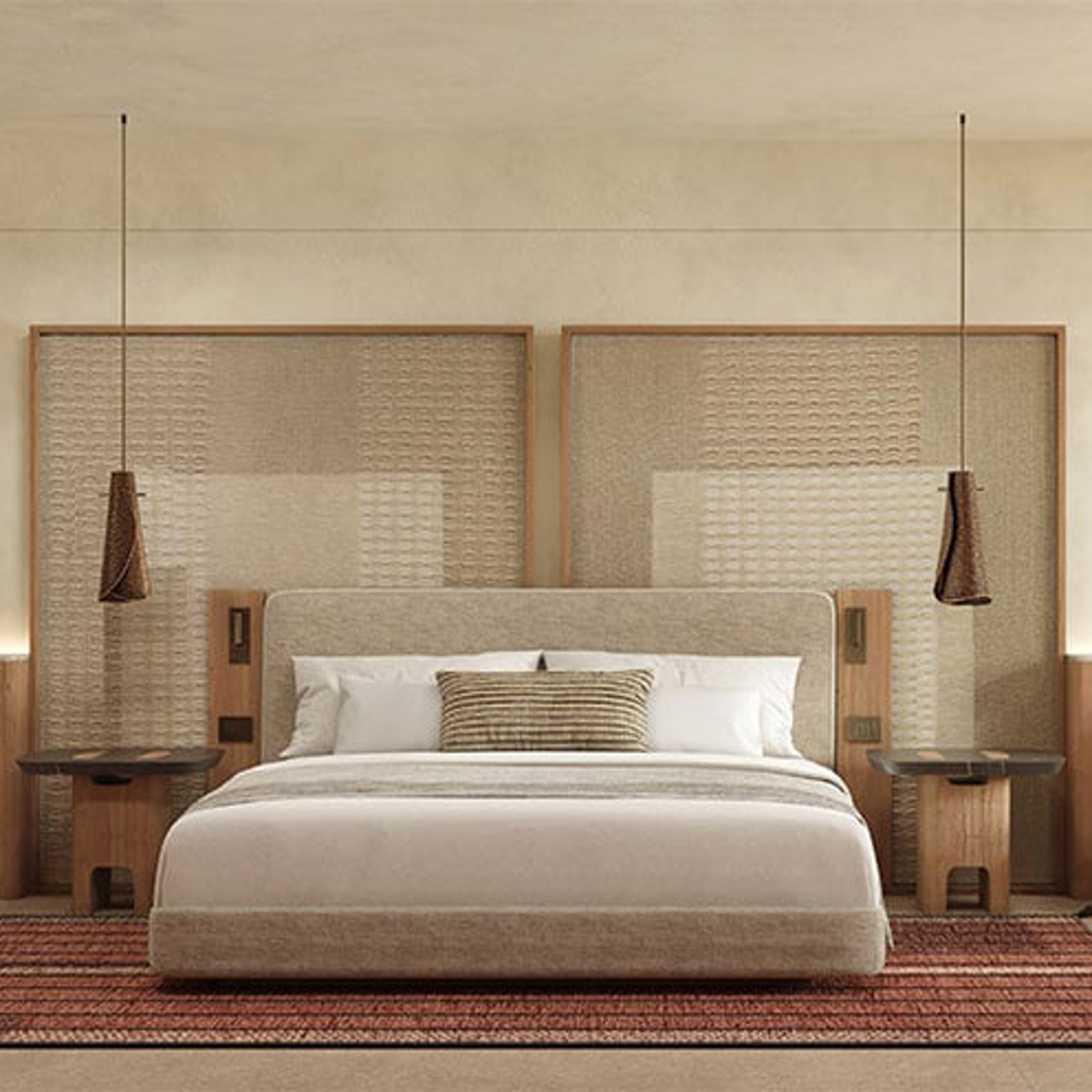 A large, modern hotel bedroom with a king-size bed, two nightstands with pendant lights, and two large woven panels behind the bed.