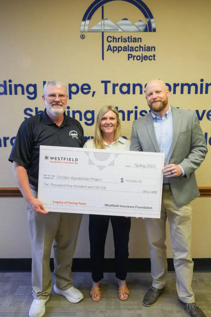 Energy Insurance Agency presents large check to CAP