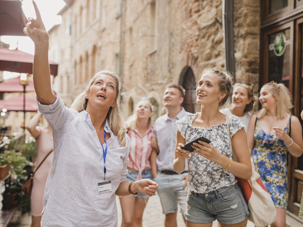 Group of tourists exploring with a tour guide