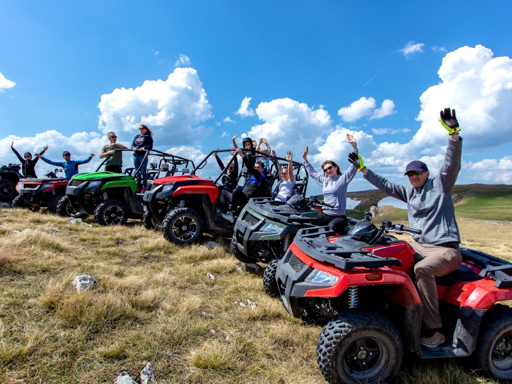Photograph of tourists on four wheeler ATVs