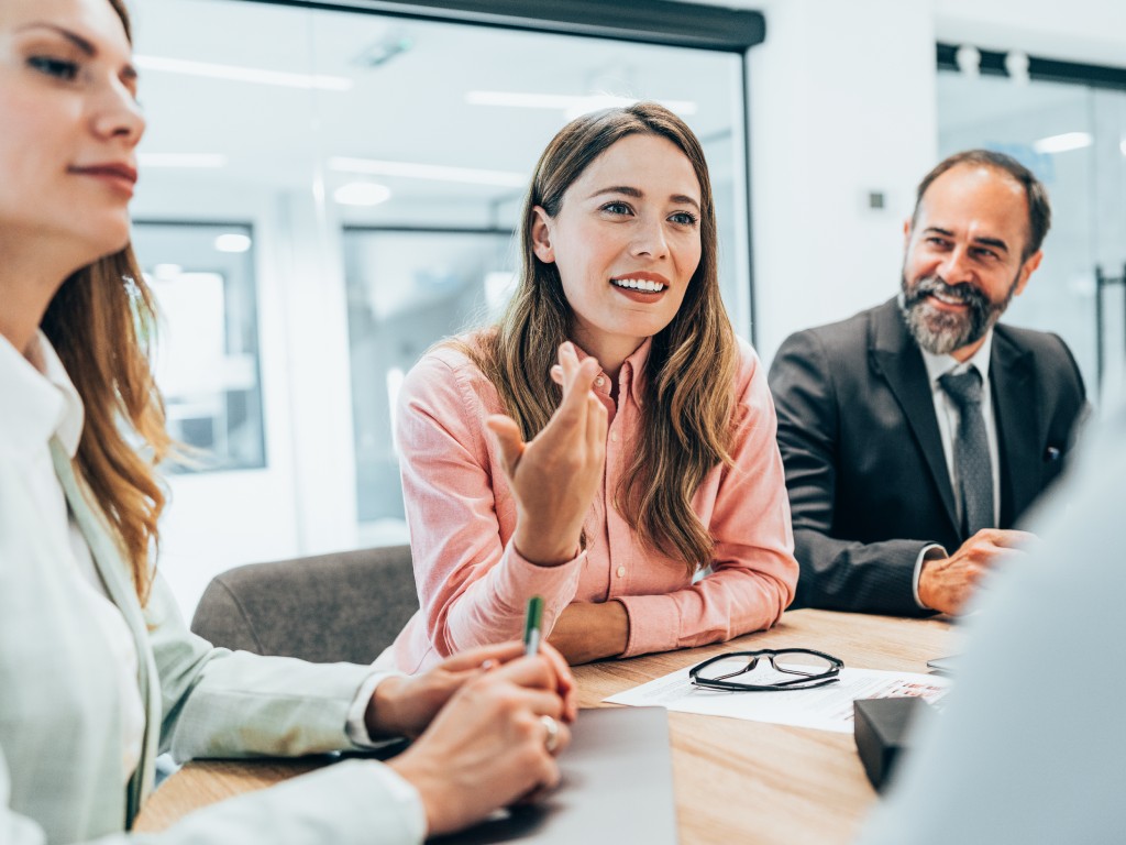 Business associates meeting around a table