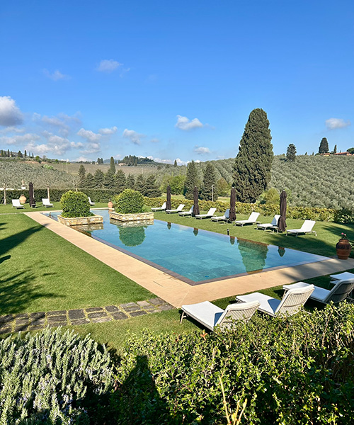 Pool on expansive, lush grounds of Villa Medici La Ferdinanda in Italy