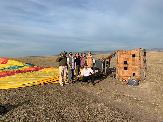 Balloon ride Serengeti group of smiling travelers