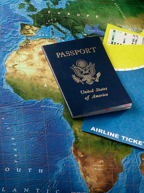 Dark blue passport sitting on map