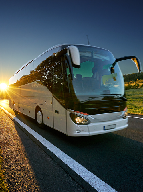 Tour bus driving down the highway