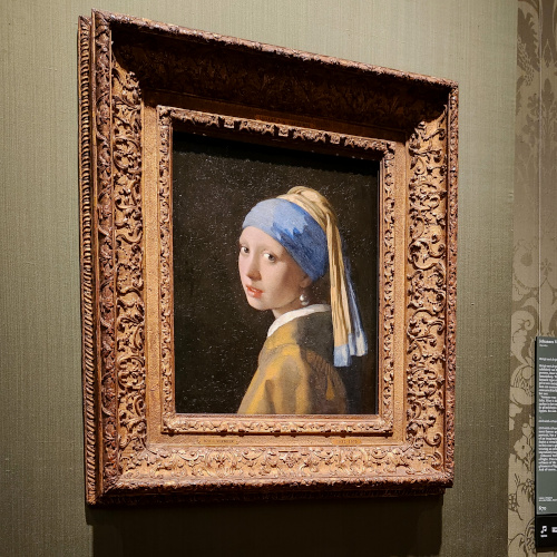 Vermeer's Girl with a Pearl Earring painting displayed in Maritshuis Museum