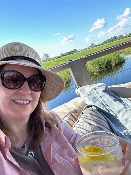 Tourist enjoying a beverage on Botswana safari