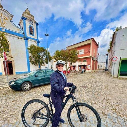 Provident Travel Advisor Lori O'Connor on bicycle touring Monsaraz medieval village