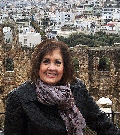 Janet McLaughlin Provident Travel on hill overlooking Sicilian town