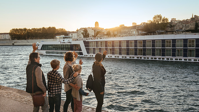 Family waves at departing river cruise ship