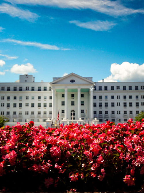 The Greenbrier resort, with beautiful flowers in foreground 