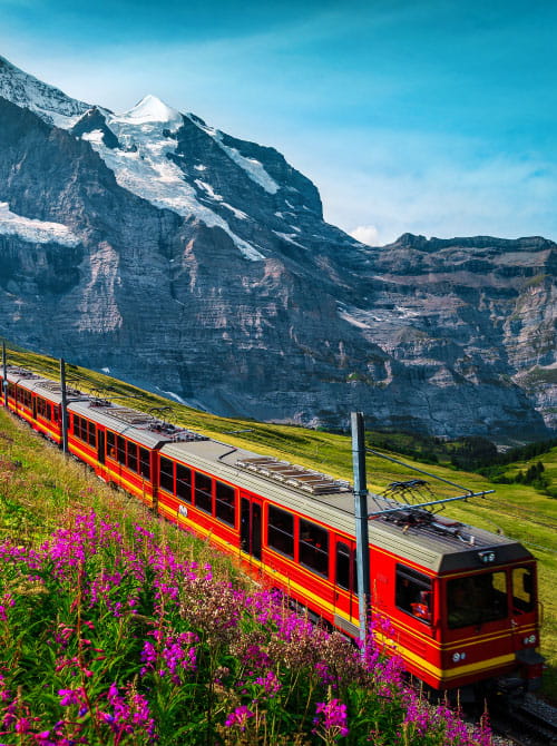 A train traveling through the scenic Austrian Alps
